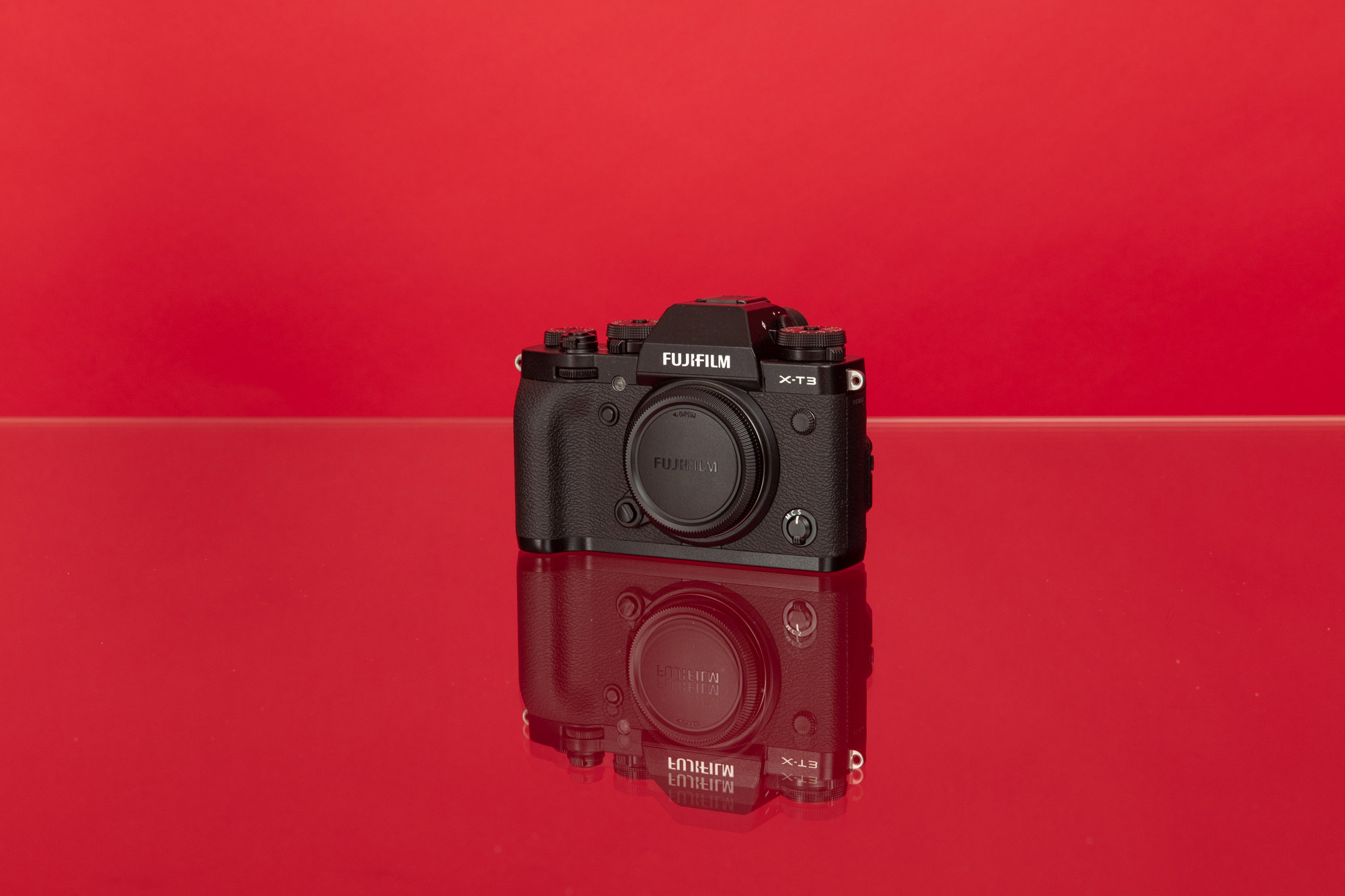 Fujifilm X-T3 against a red background