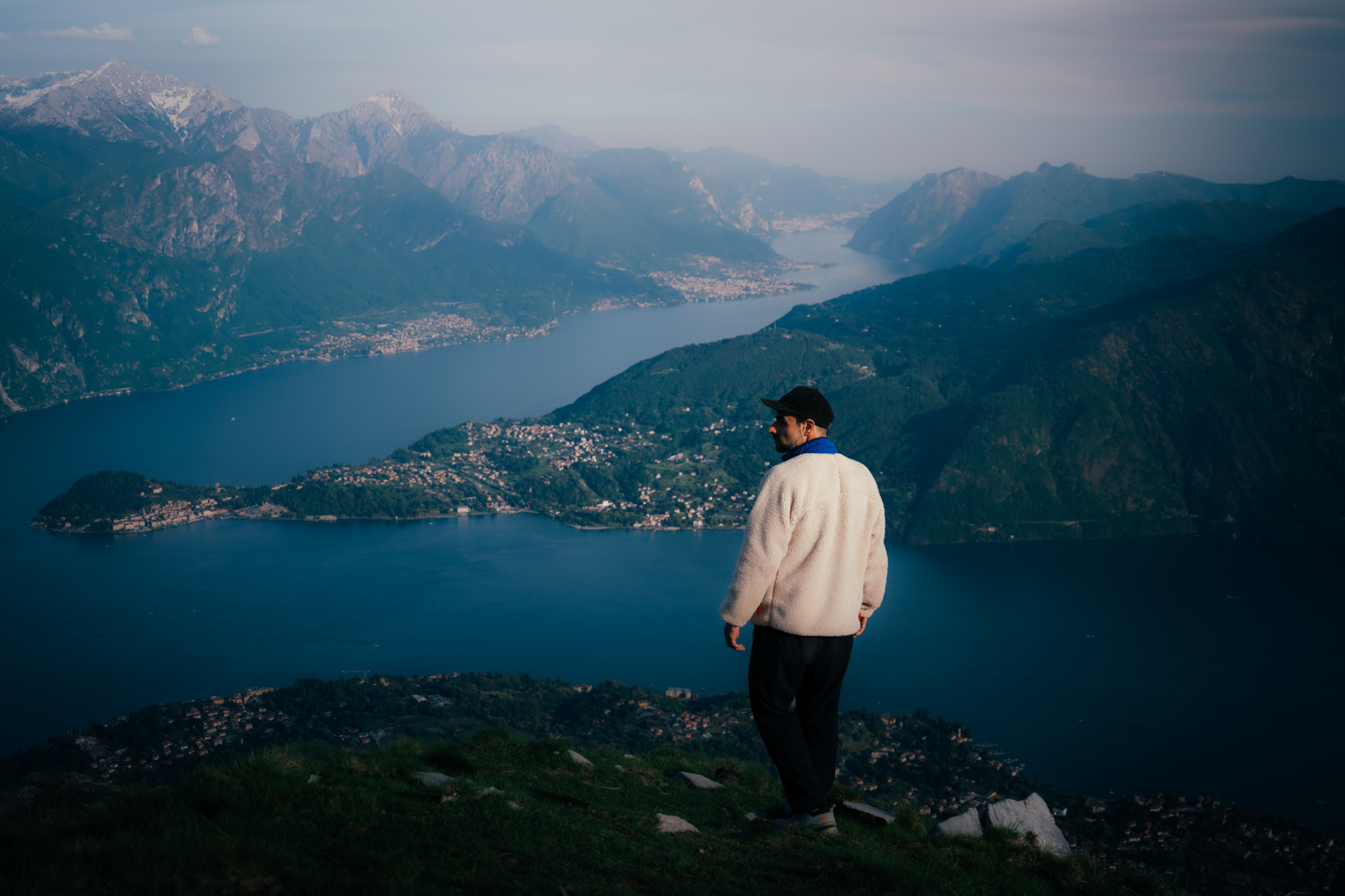 Photographer at a scenic viewpoint overlooking Lake Como