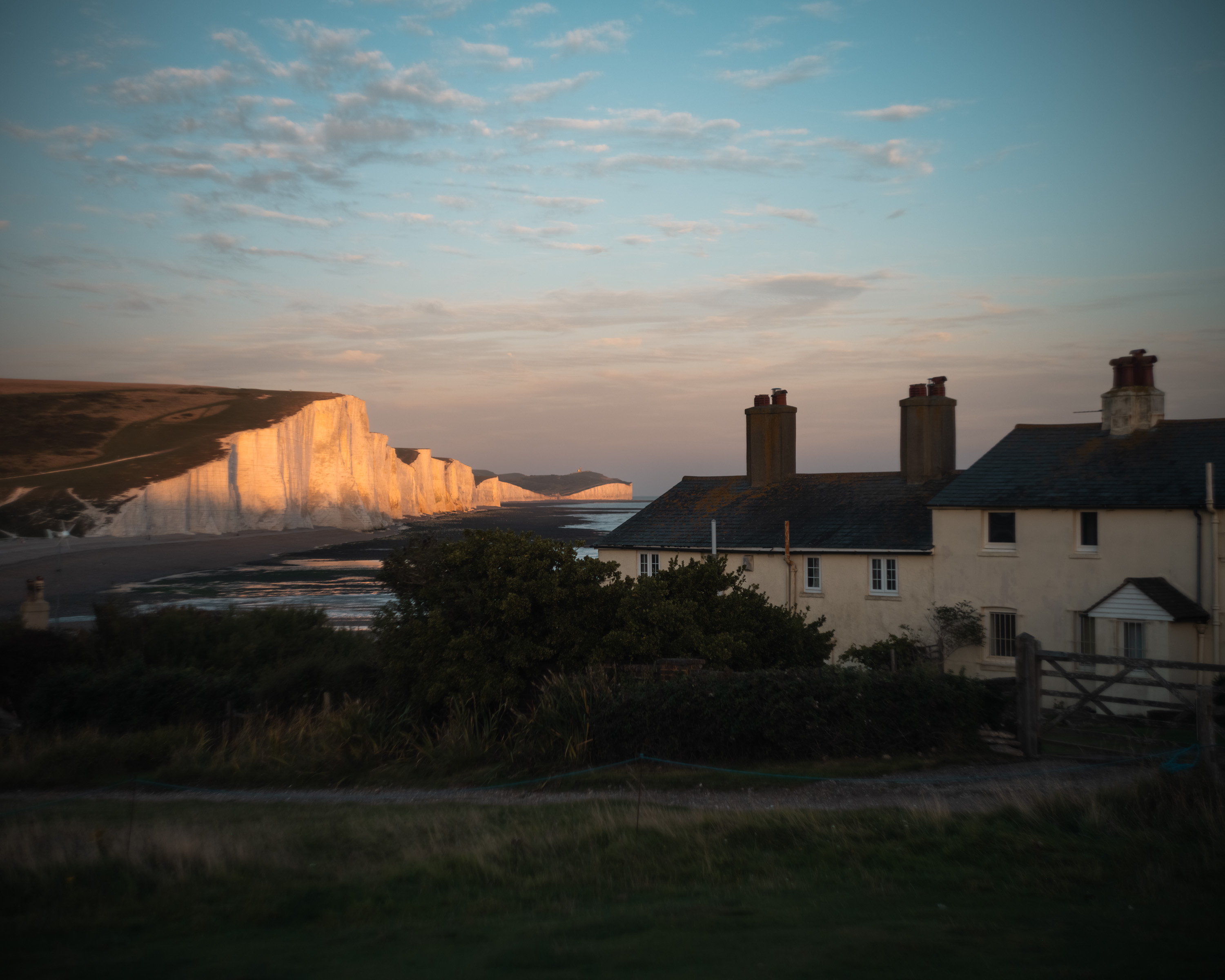 
A wide landscape shot of the sea cottages in Cuckmere Haven with the seven sisters cliffs in the background. Taken on the Fujifilm GFX 50R by Ian Howorth. 

