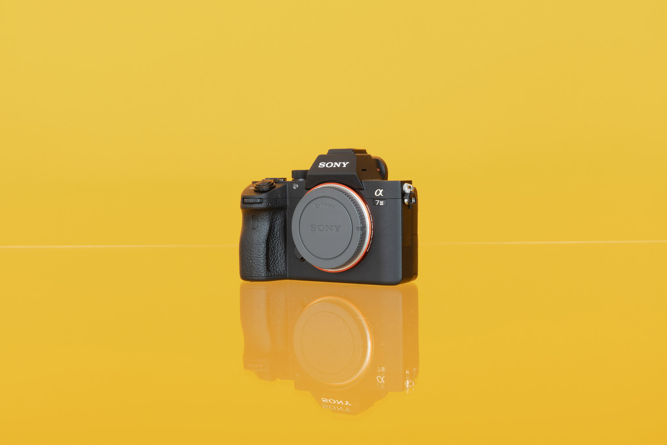 Sony A7 III against a yellow background