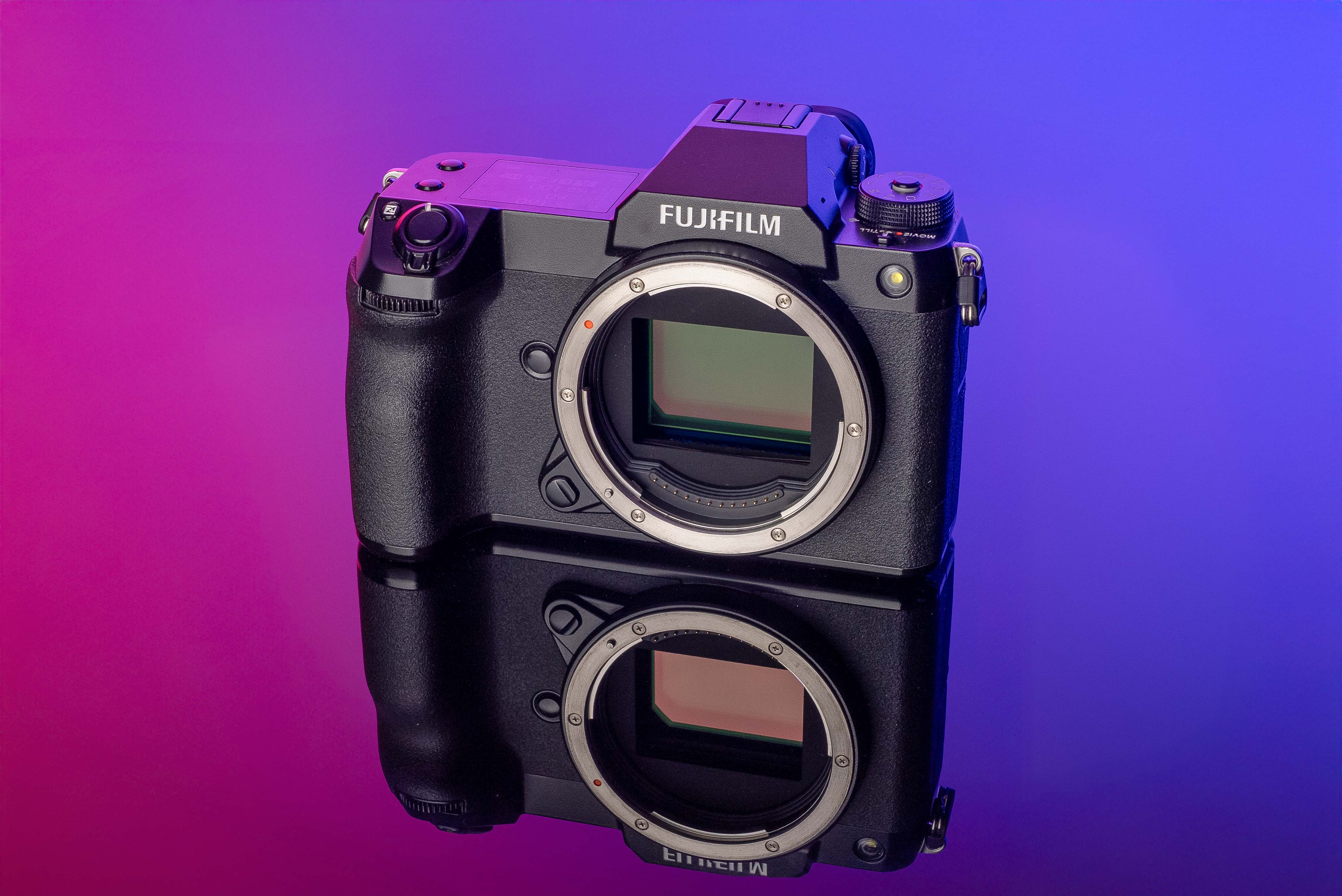Fujifilm GFX 100S on a purple and pink background 