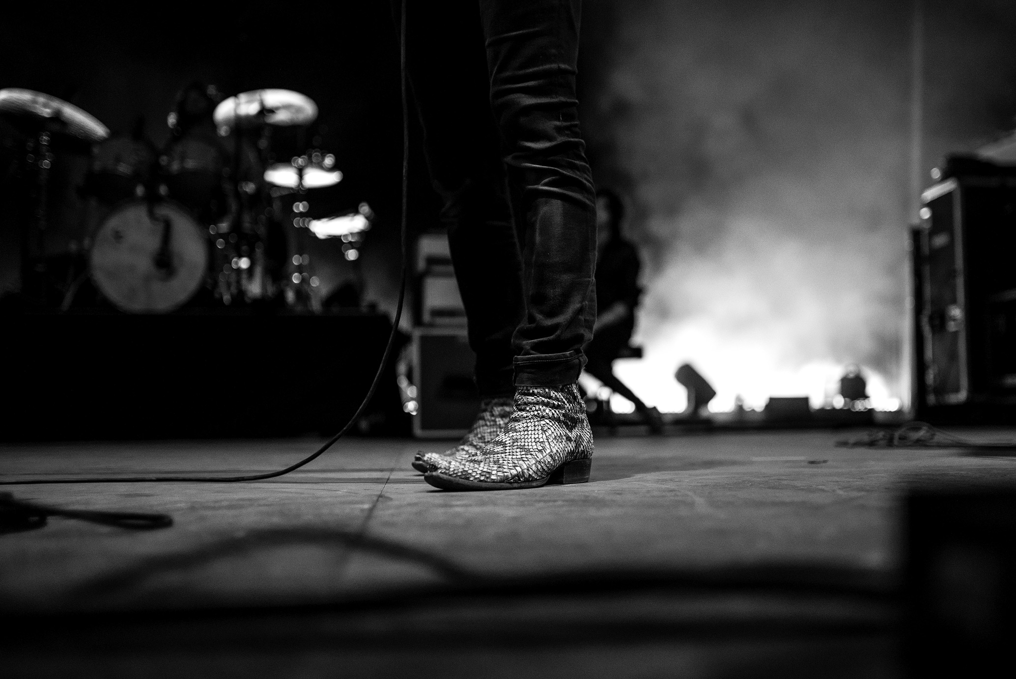 Leather boots of Jonathan Russell lead singer of Head and the Heart on stage, photo taken by James Joiner on a Nikon D750.