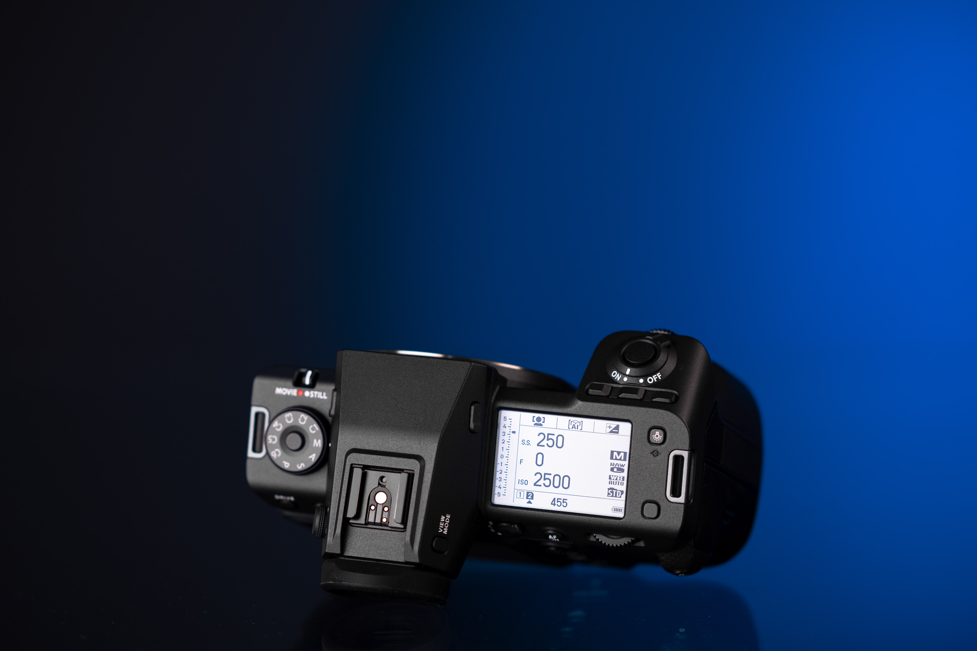 Top of the Fujifilm GFX 100 II on a blue and black background