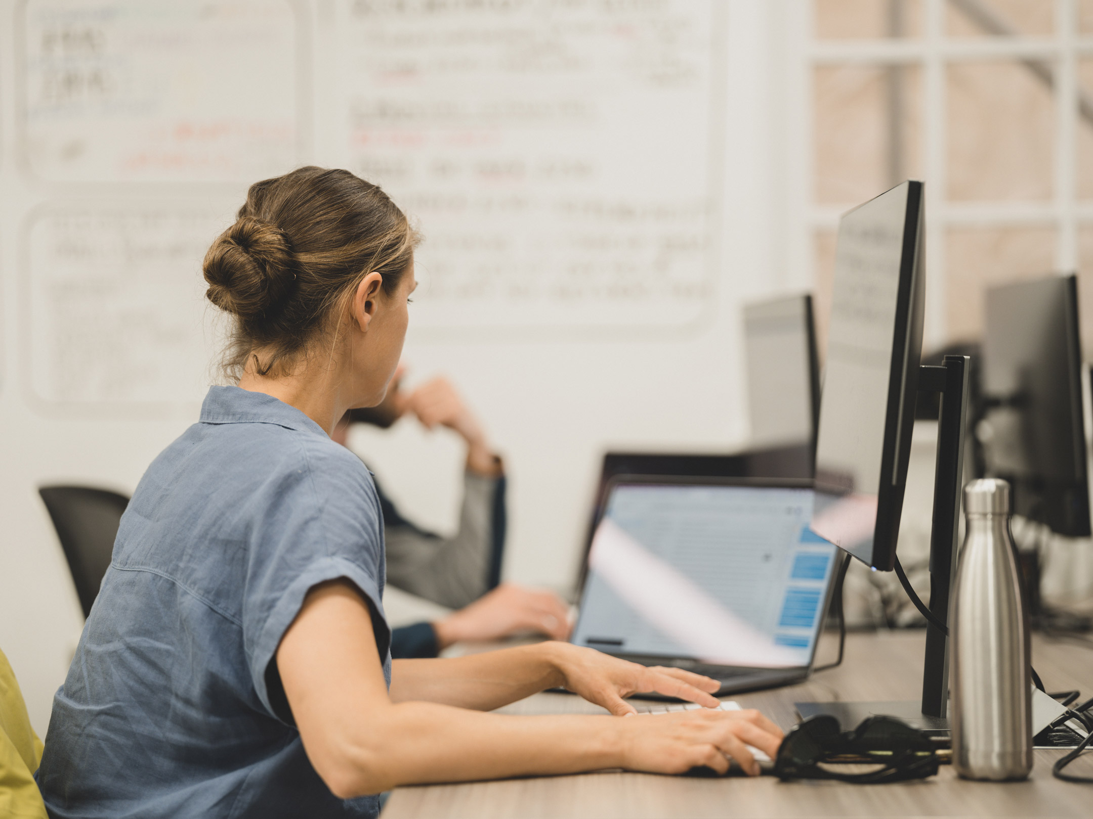 MPB team member looking at their computer