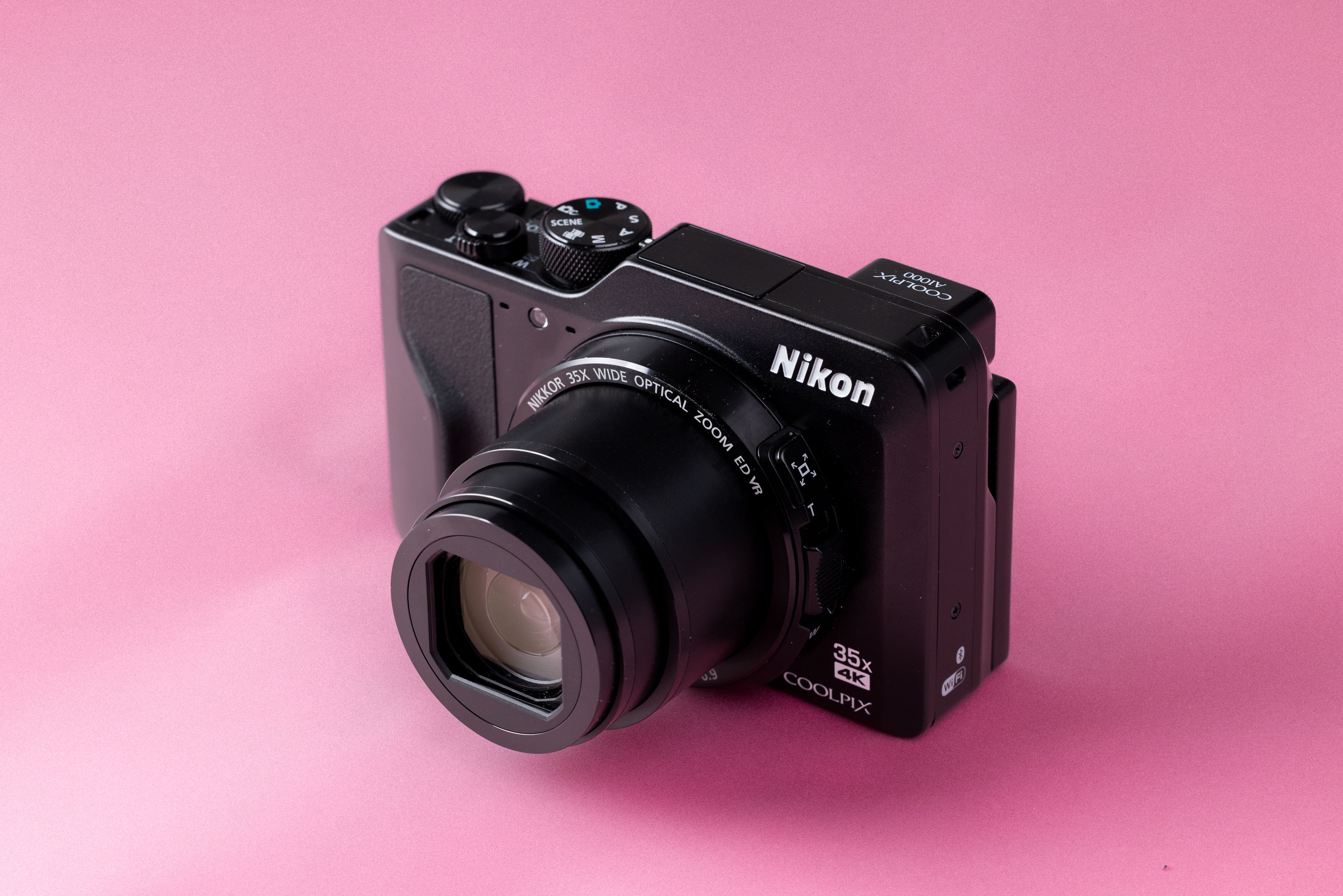 Nikon Coolpix A1000 on a soft pink background.