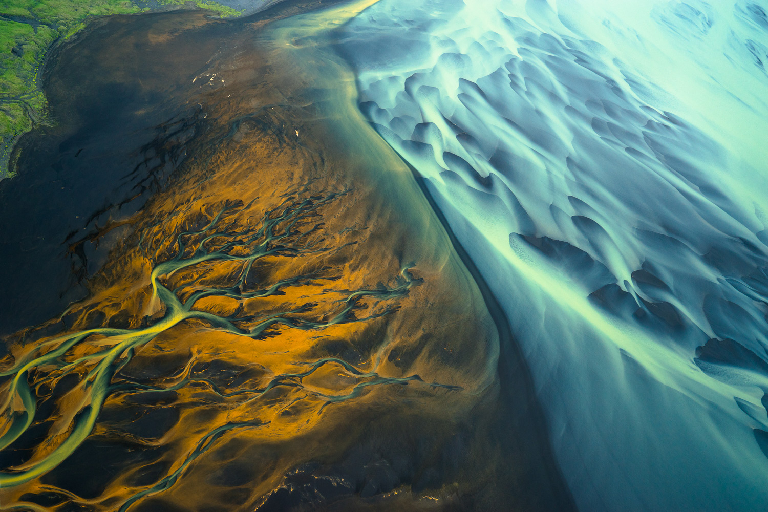Aerial photo featuring bright blues, greens and yellows