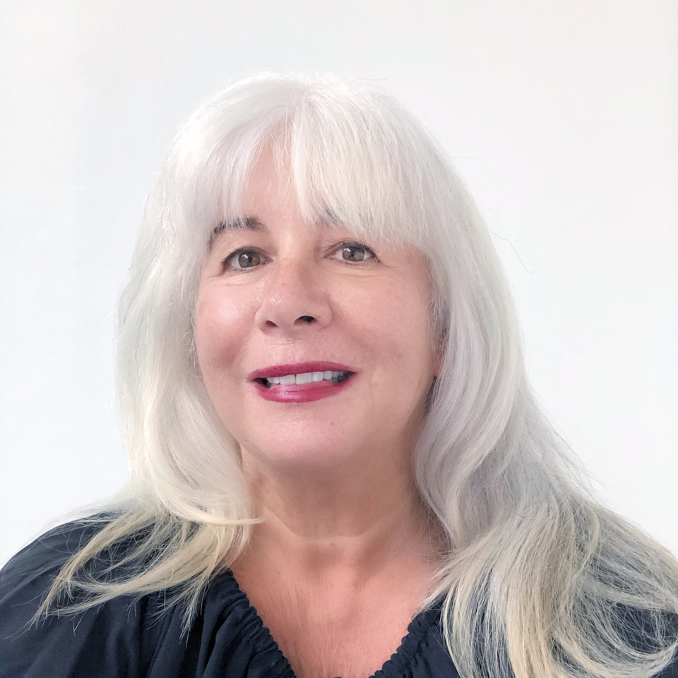 A portrait photo of Karen Knorr wearing a dark top