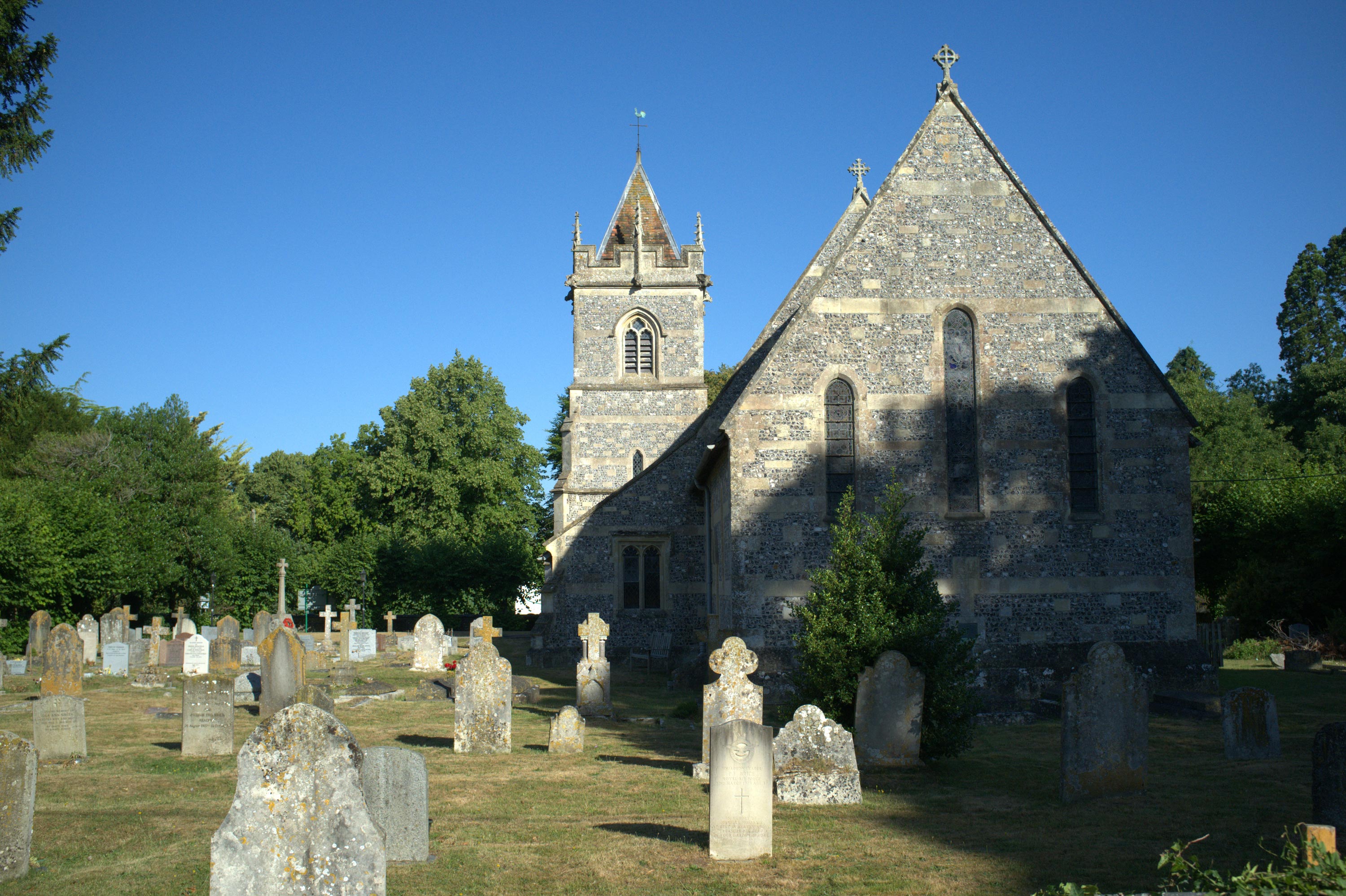 A churchyard on a sunny day, photo by Laura Milner with a Fujifilm X100
