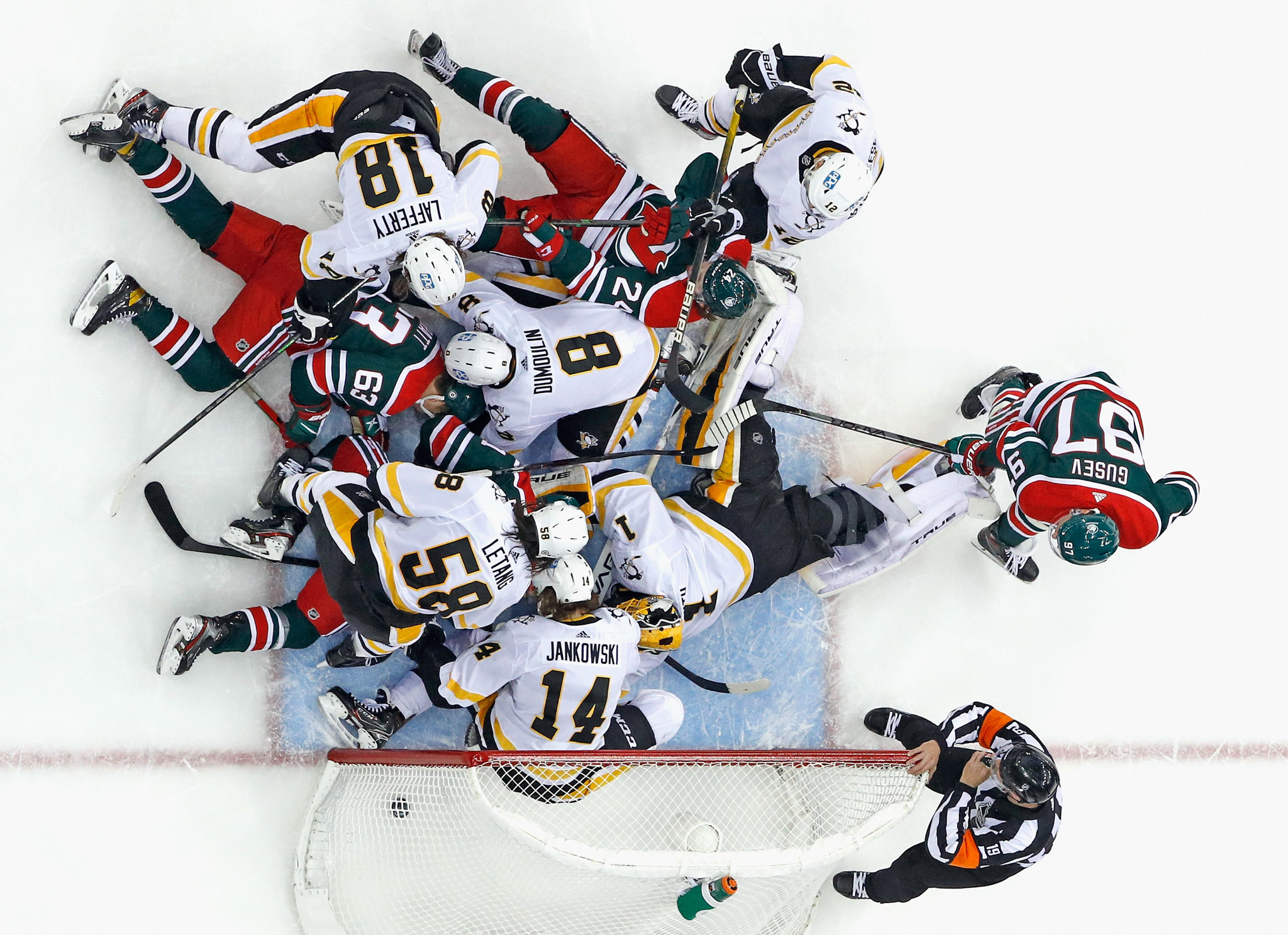 Top-down image of a brawl in an ice hockey game