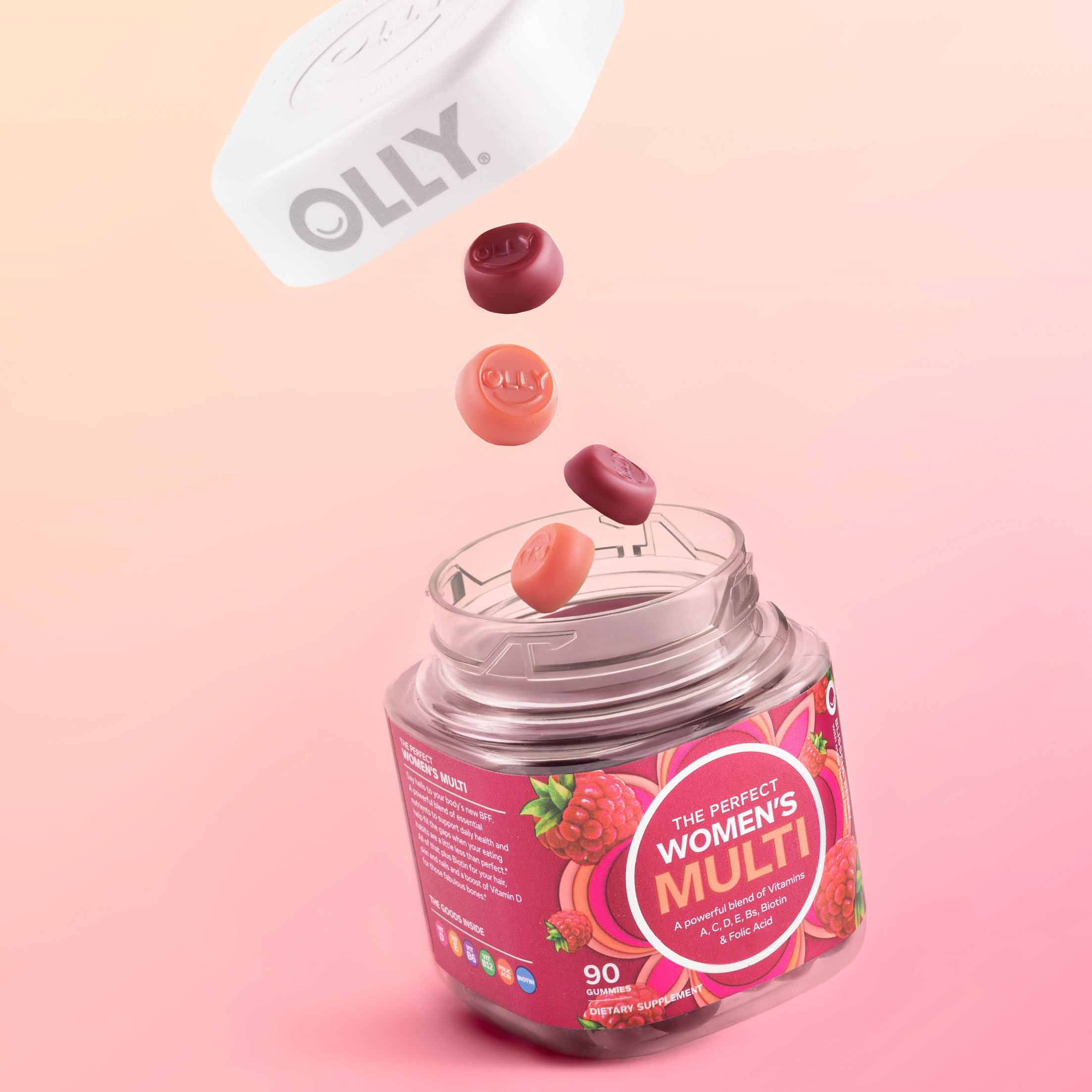 Olly vitaminen op een roze en perzikkleurige achtergrond.