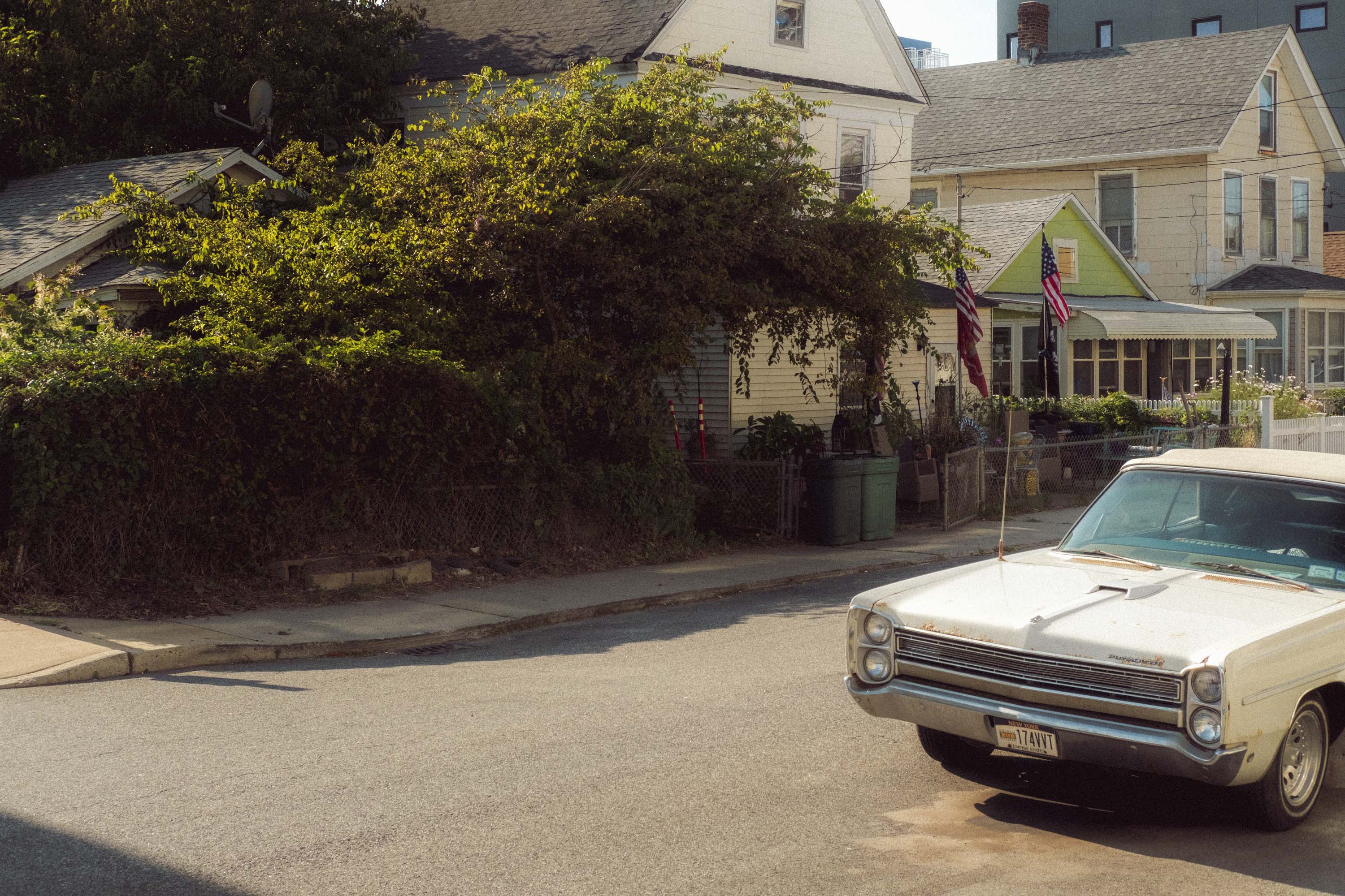 A cream vintage car parked in the street. Shot on the X-Pro 3 by Ian Howorth.