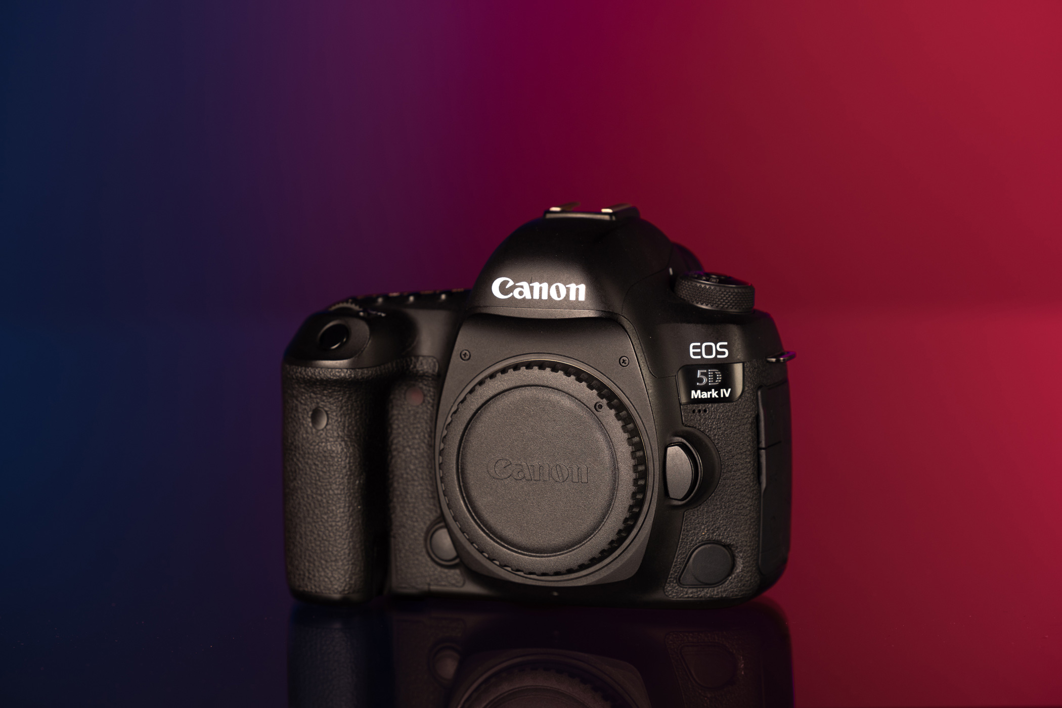 Canon EOS 5D Mark IV against a navy and red background.