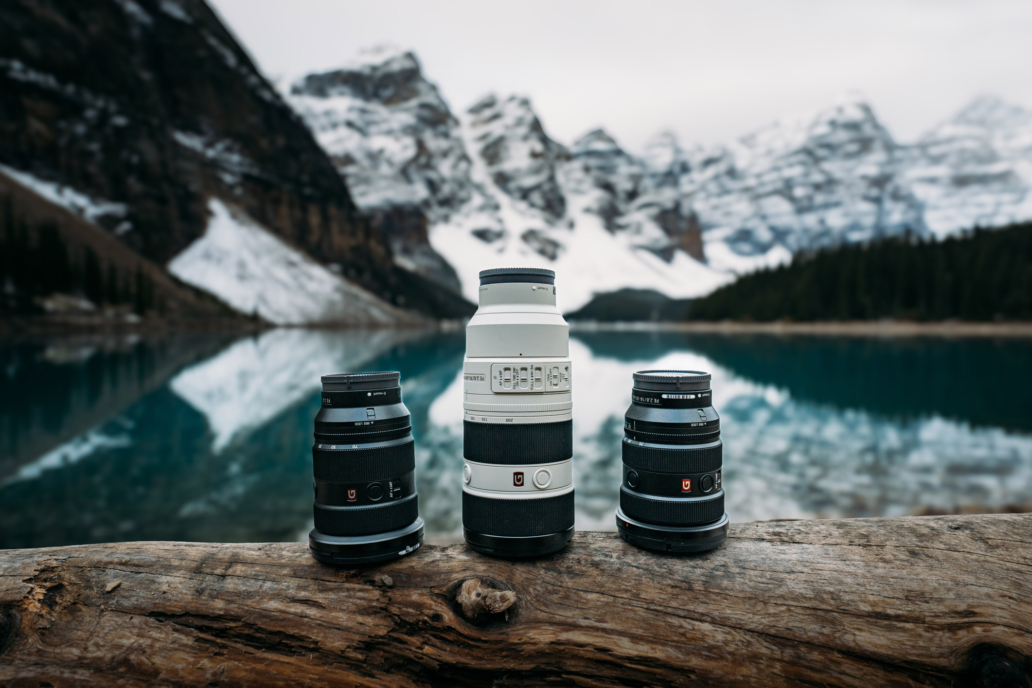 Three Sony FE lenses in front of Lake Moraine in Banff National Park, by Jude Allen.