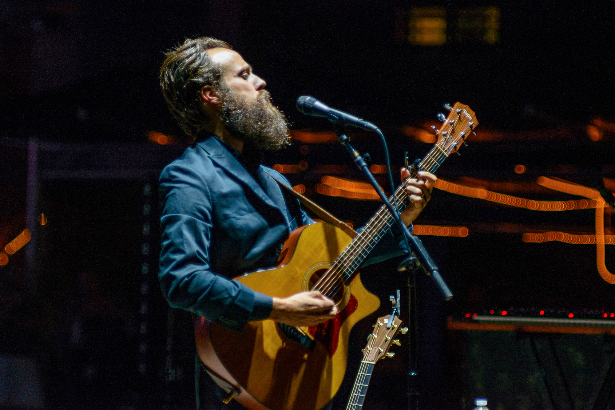 Samuel Ervin Beam, better known as Iron and Wine on stage playing the guitar. Photo taken by James Joiner