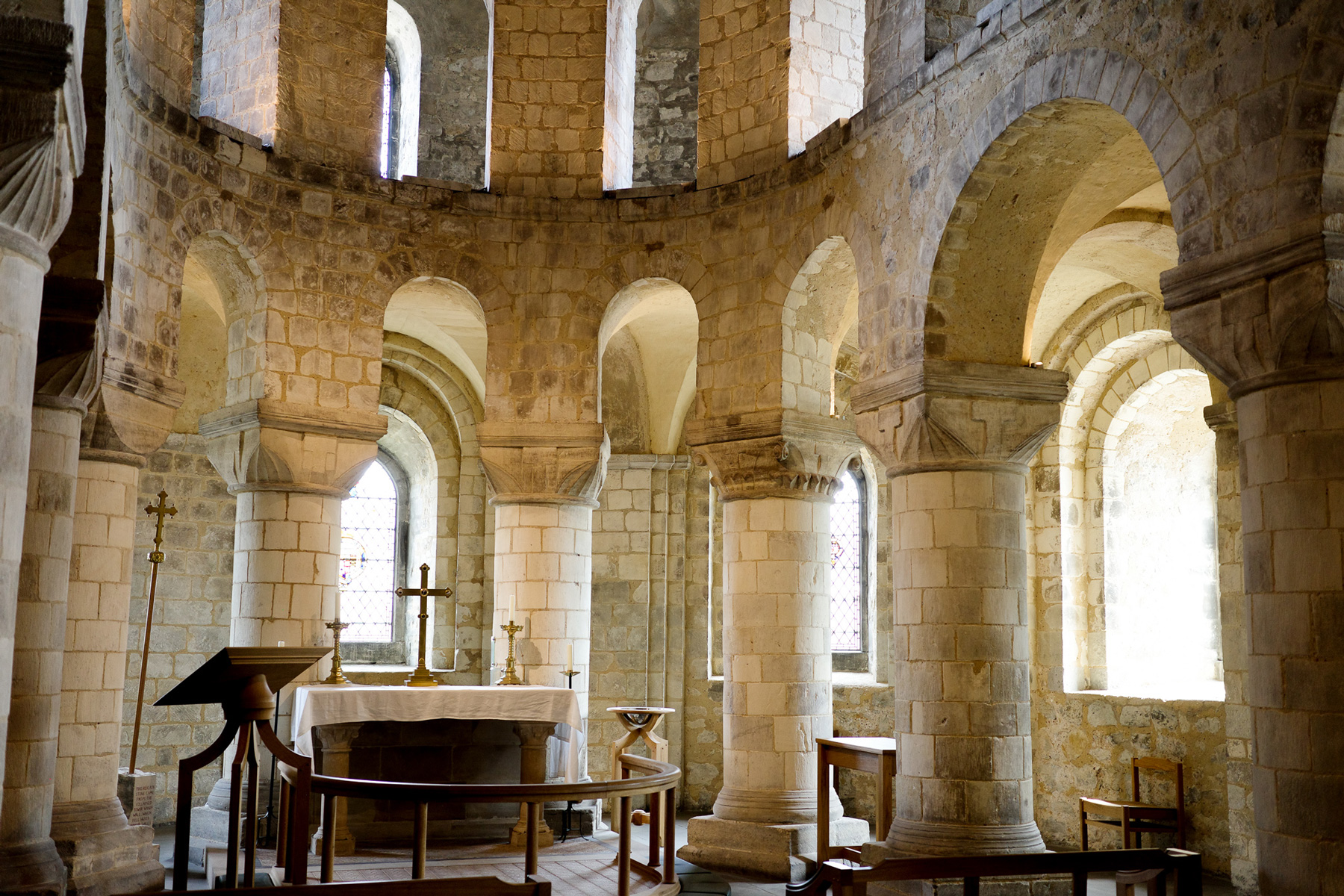 A colour photo of ancient stone arches surround the altar in the Chapel at the Tower of London, shot with a Ricoh GR III