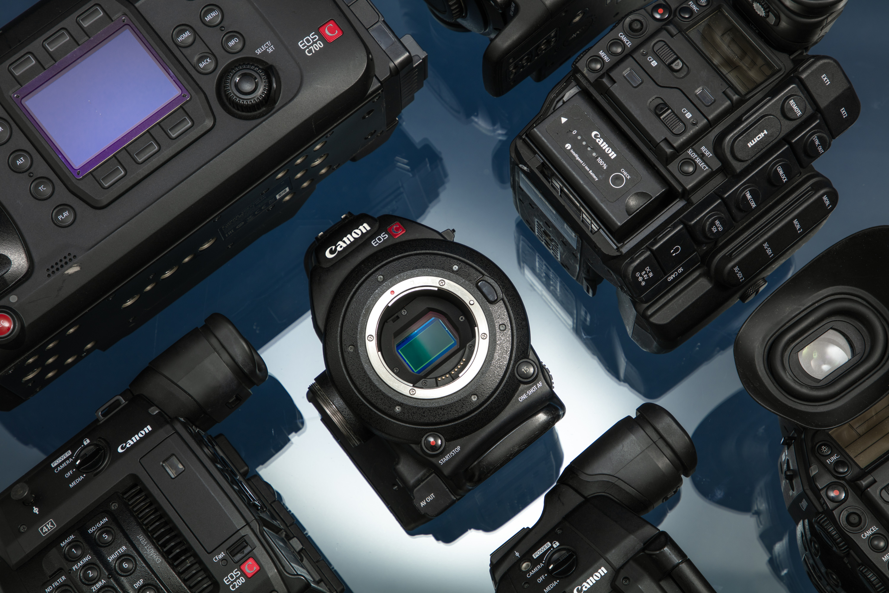 Flat lay of various Canon cine cameras.