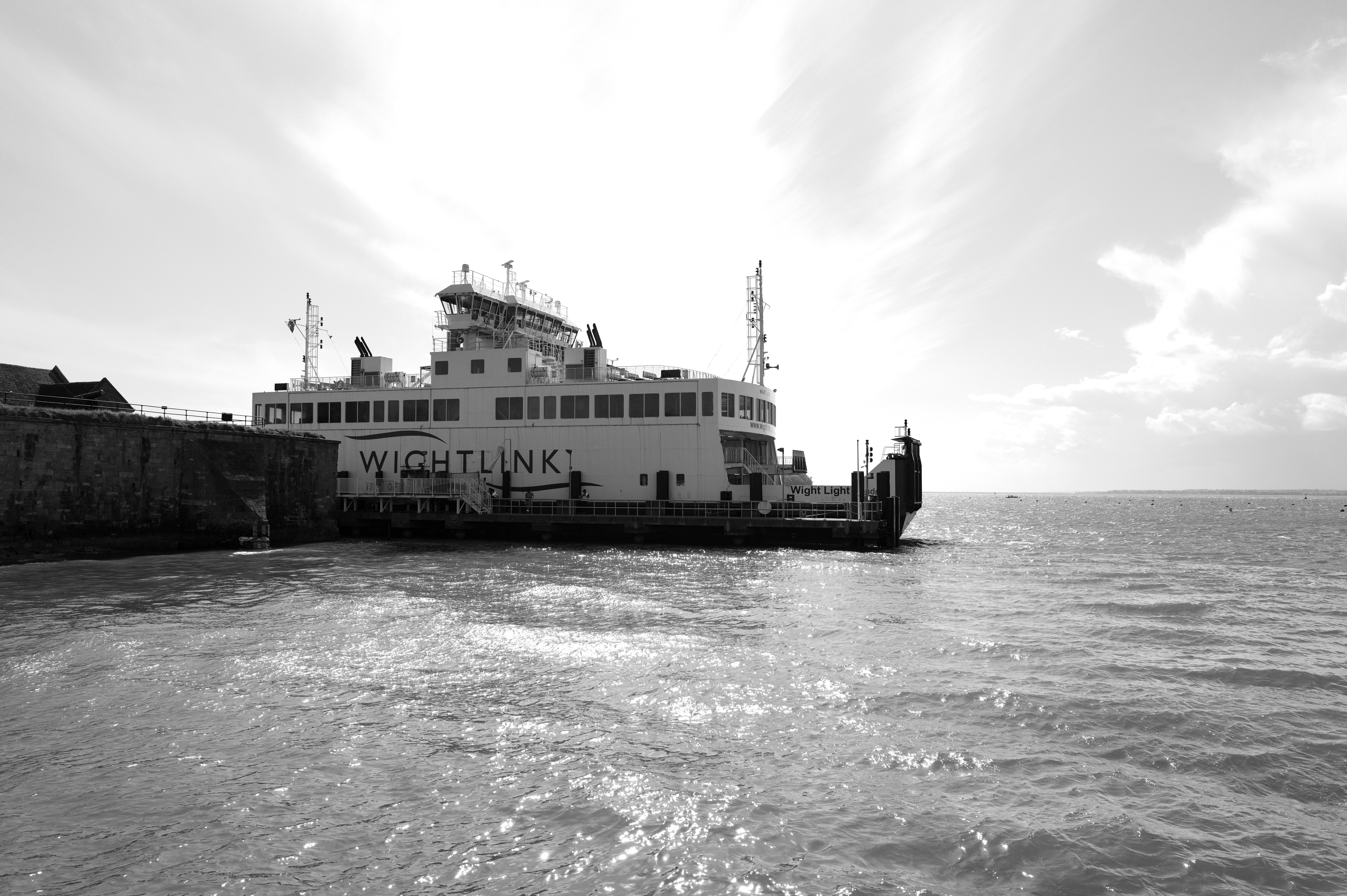 A black and white image of the Wightlink ferry at the port of the Isle of Wight.