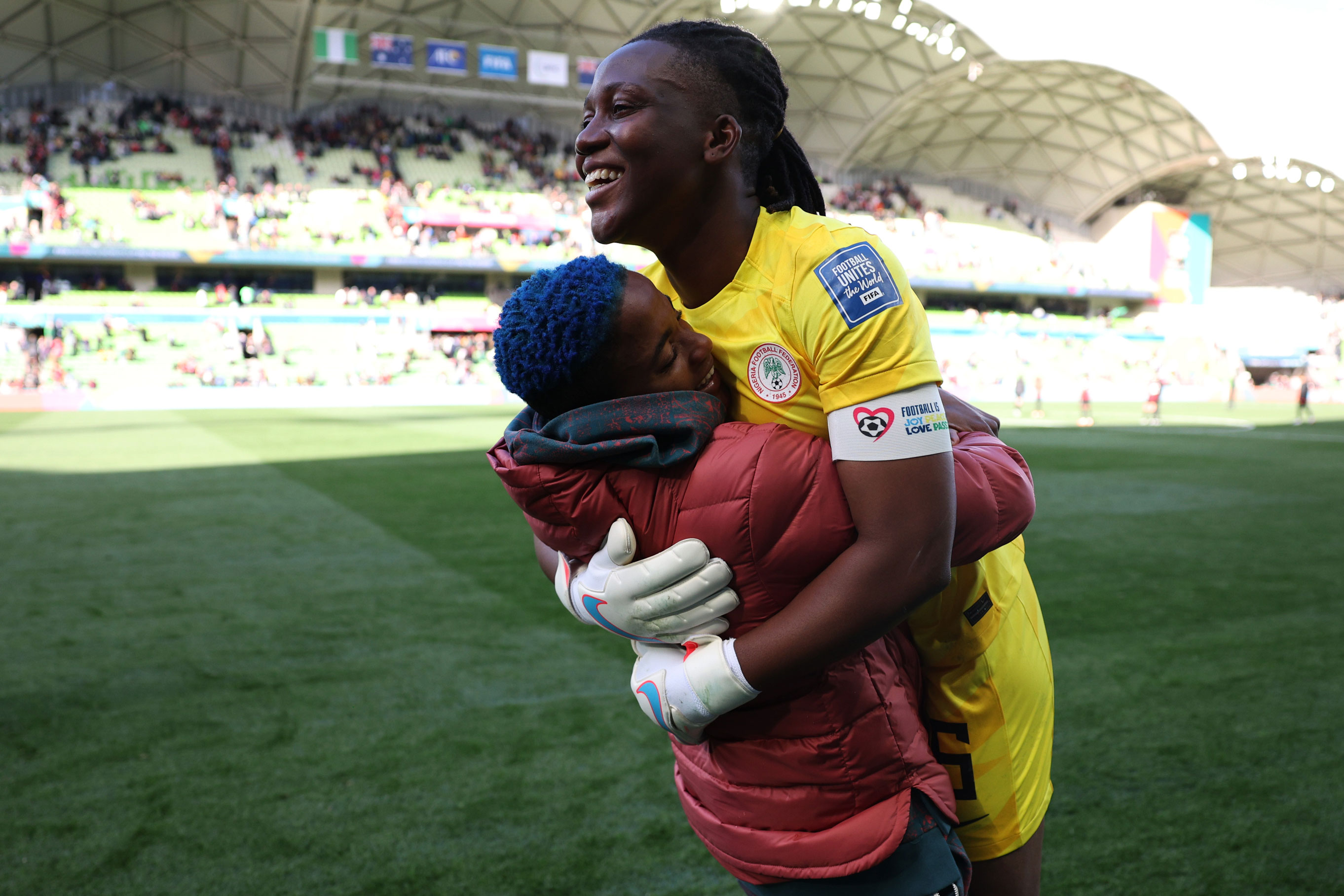 Chiamaka Nnadozie (Nigeria) embracing a teammate following their goalless draw against Canada during the 2023 FIFA Women’s World Cup, photo by Elsa Garrison with a Canon EOS R3