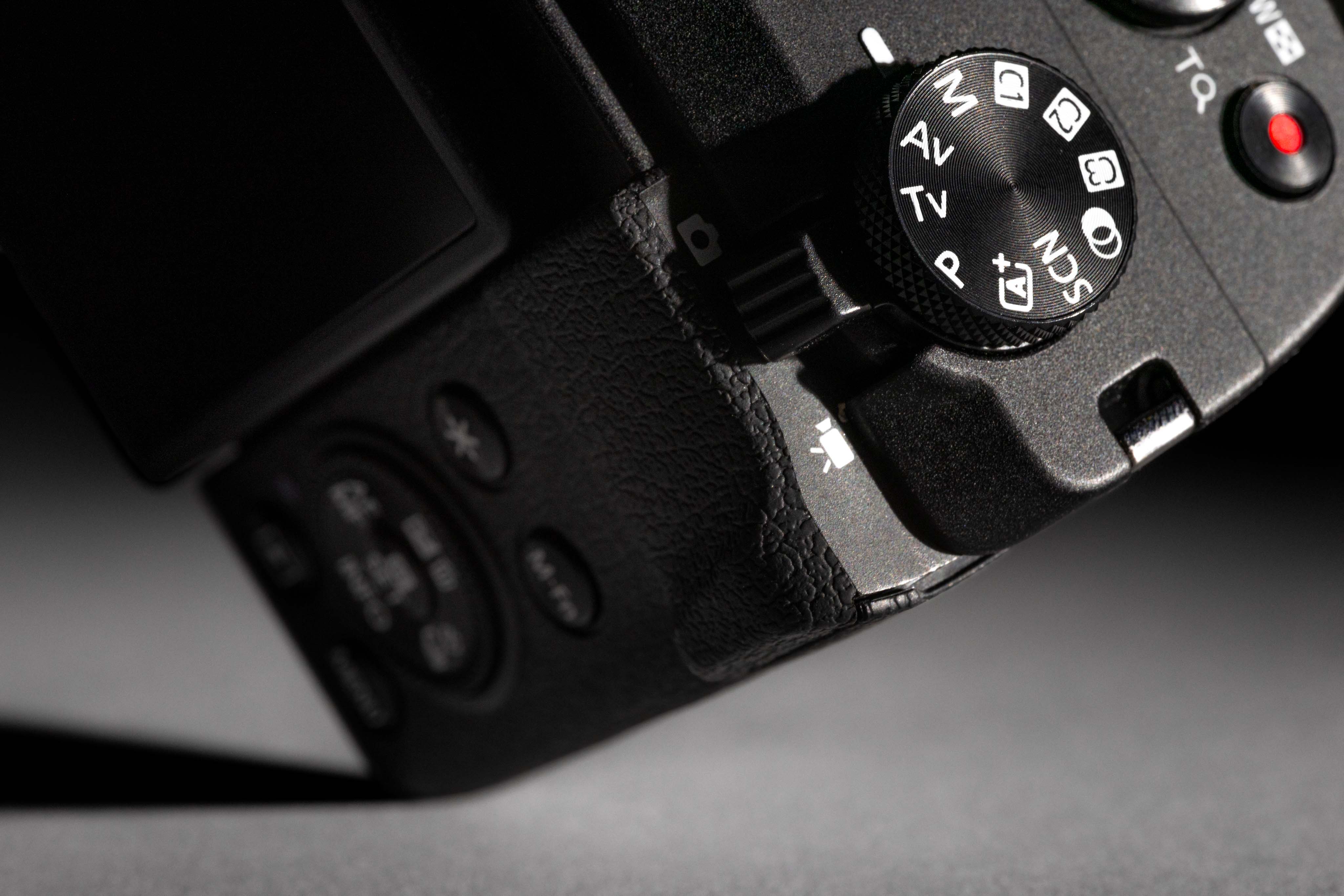 Closeup photo of a used Canon PowerShot V1 from MPB in a studio, showing topside of the camera. Image by Connor Redmond.