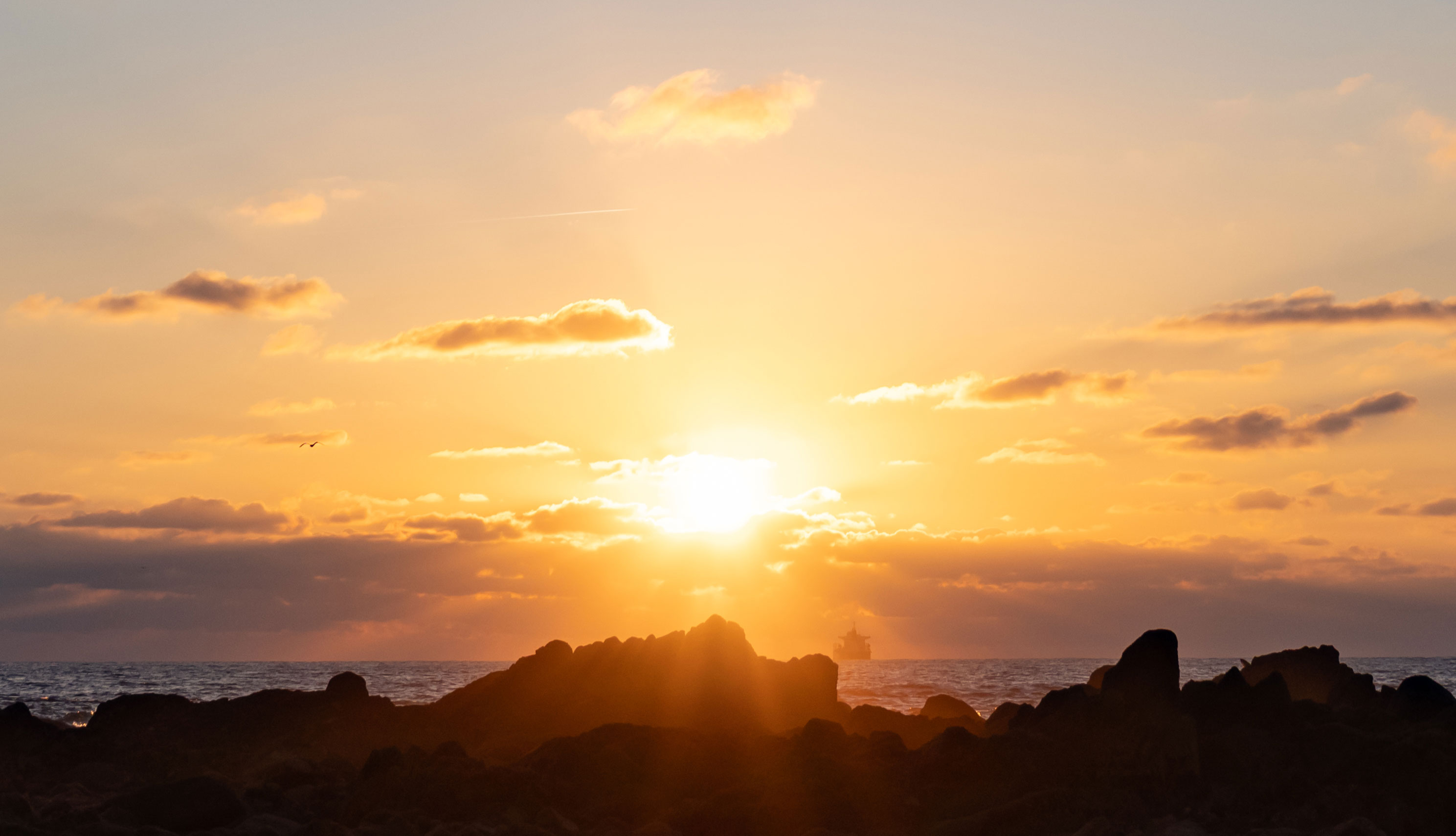 Sunset over the water in Porto, Portugal. Shot on the Fujifilm GFX100RF by Amy Moore.