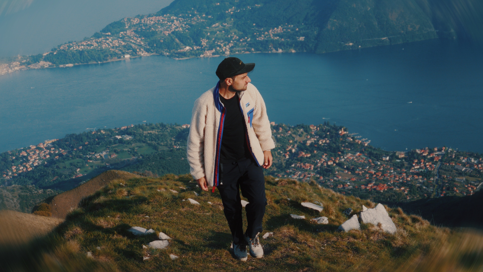 Videographer on a peak overlooking Lake Como