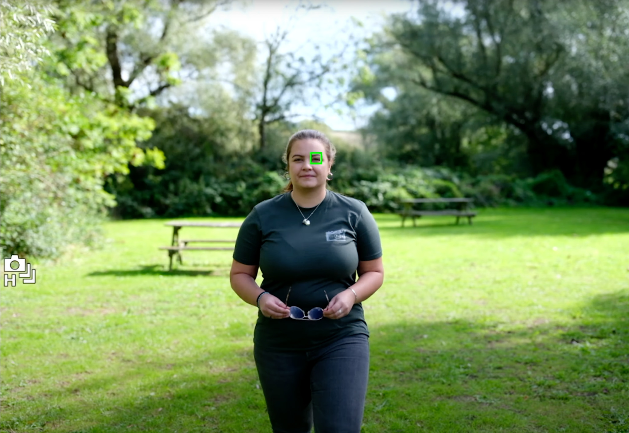 An image demonstrating the autofocus tracking with a green tracking box over the person's eye