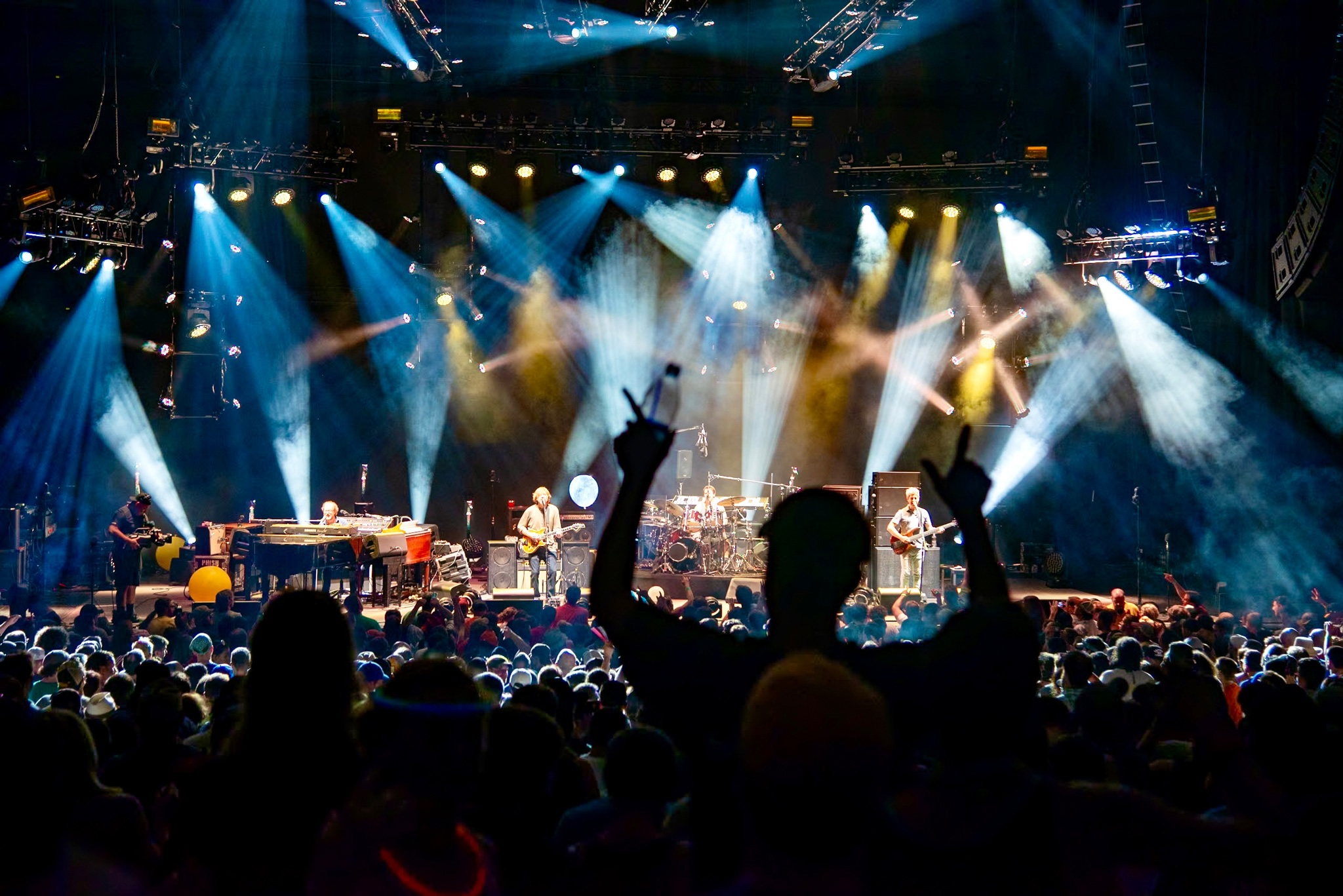 Wide image from the back of the crowd of a Phish concert. Taken on a Nikon D800.