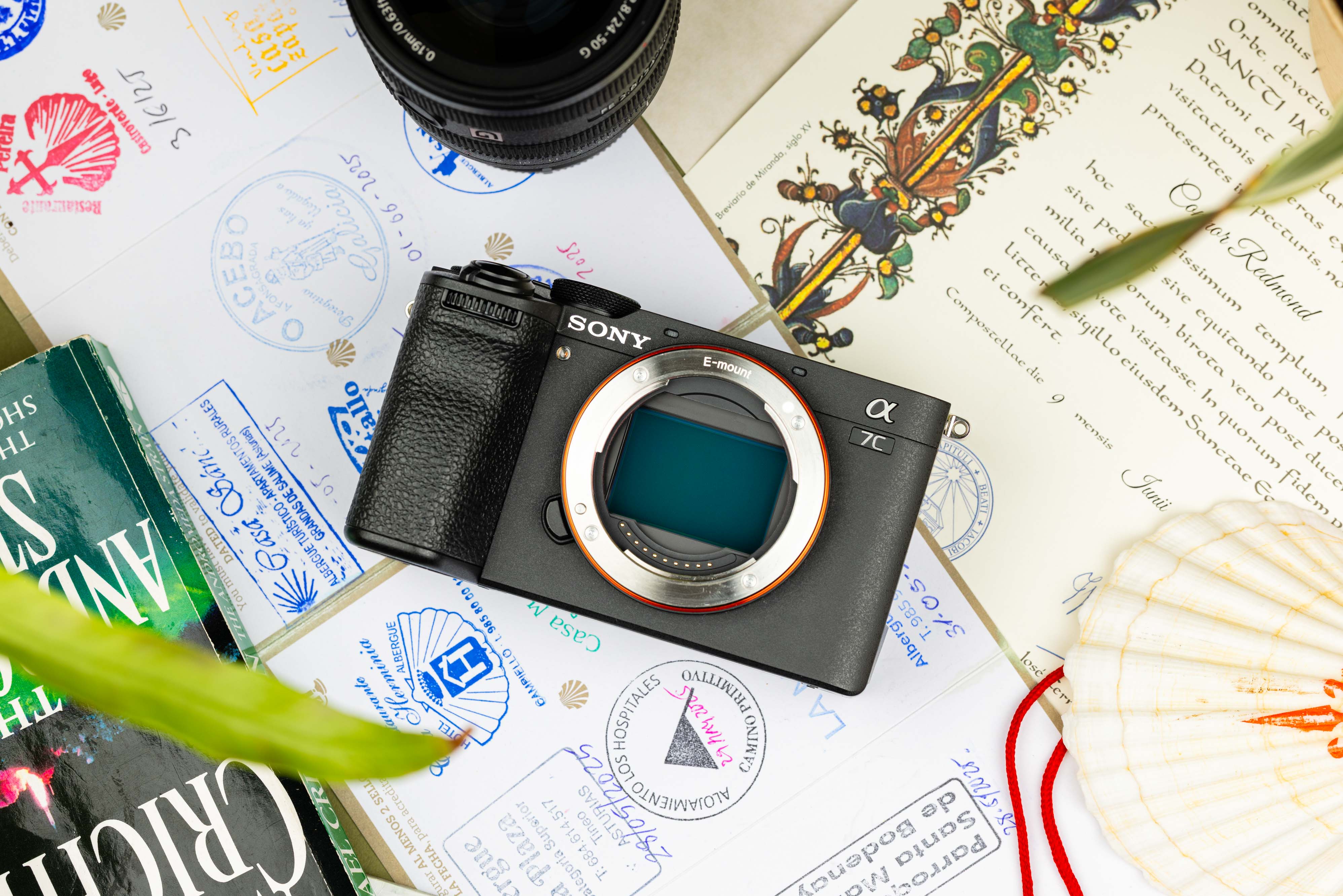 Used Sony A7C II resting on an official pilgrim credential (Pilgrim's Passport) 

