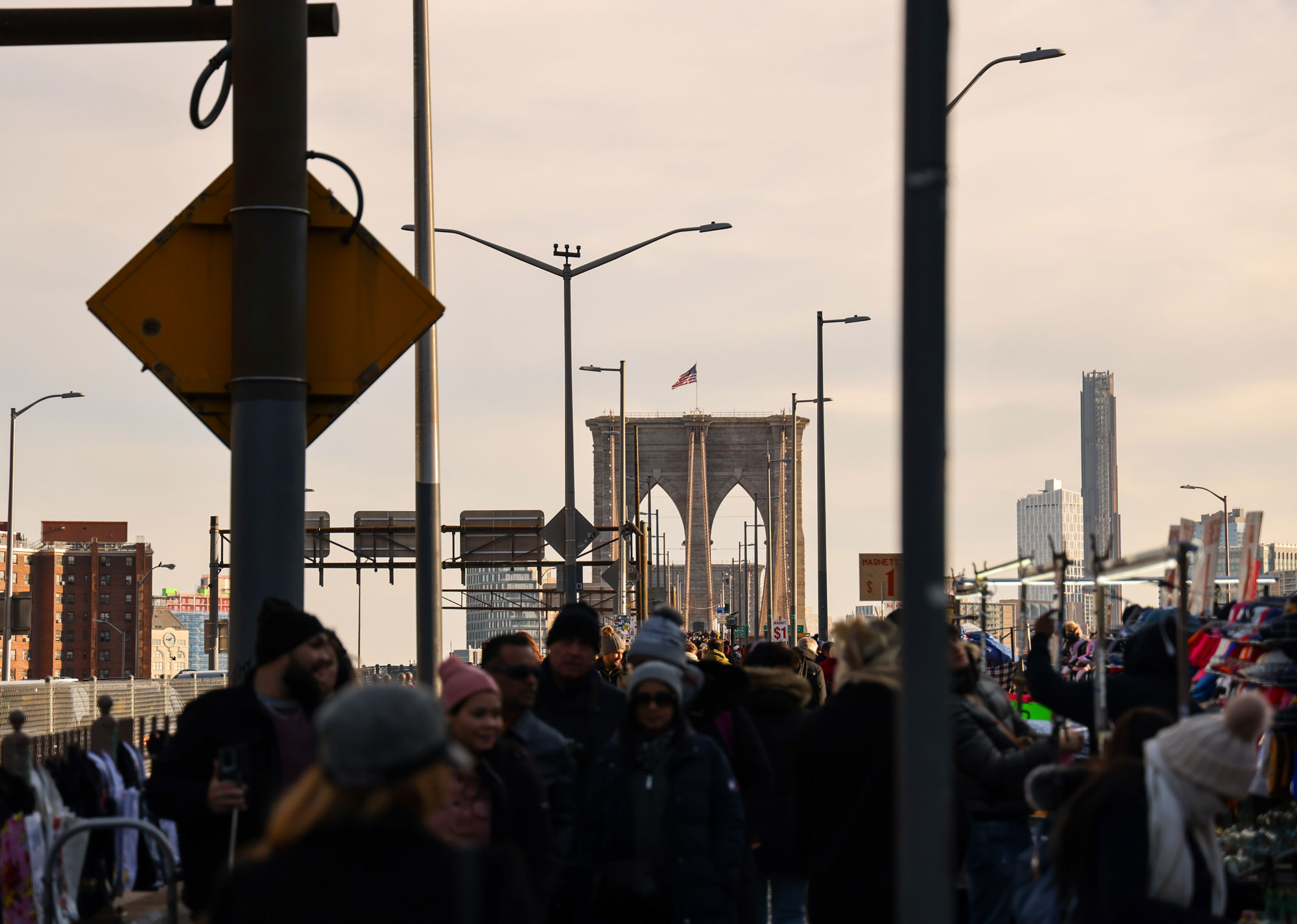 View of people walking across the Brooklyn Bridge from Manhattan at sunset. Taken with a Canon R5.

Canon EOS R5 | 105mm | f/4.5 | 1/1,250 | ISO 160