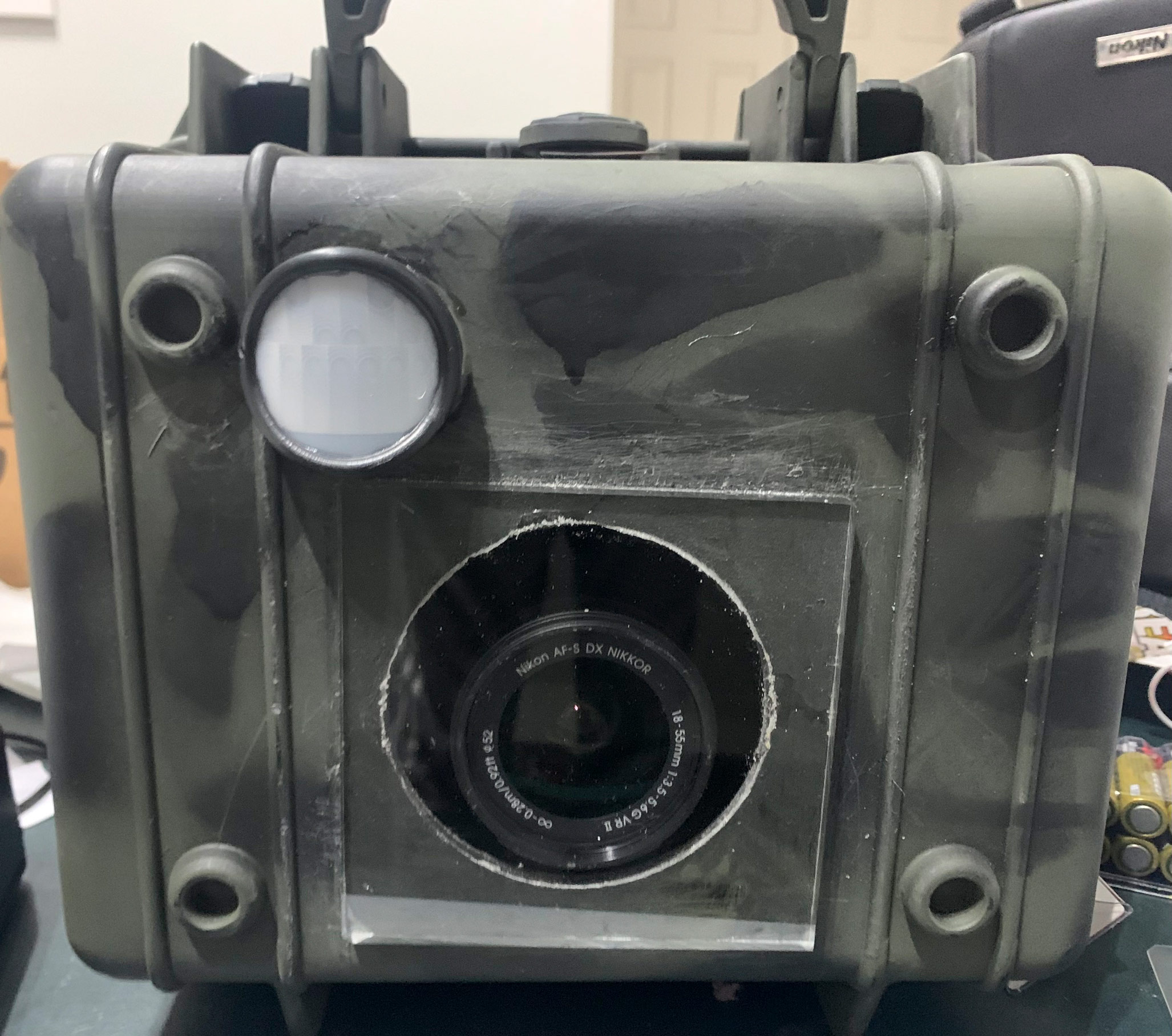 PIR sensor and DSLR camera built into Pelican case to make a Wildlife Camera Trap