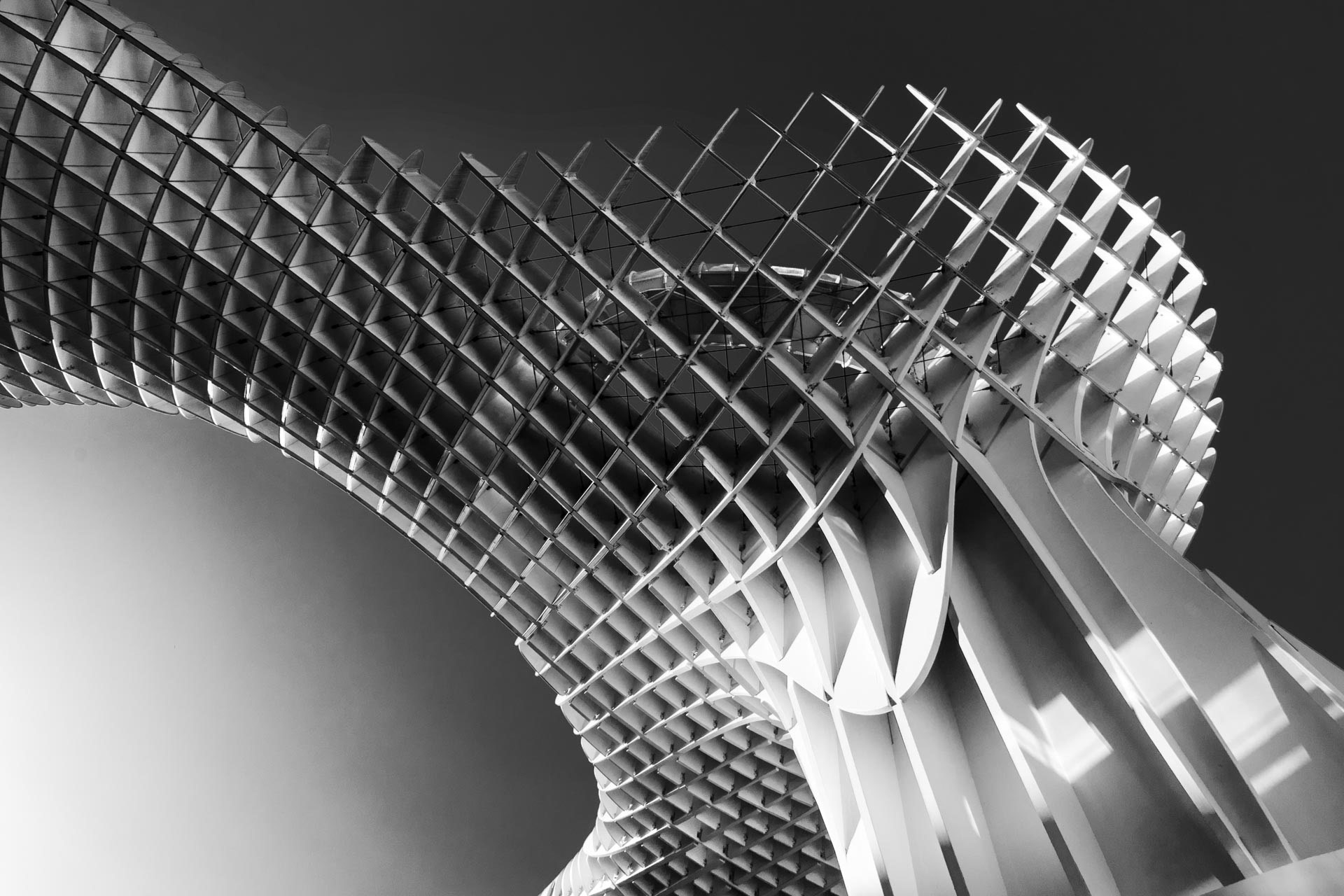 Black and white photo of Las Setas, a mostly wooden structure in the old quarter of Seville, Spain