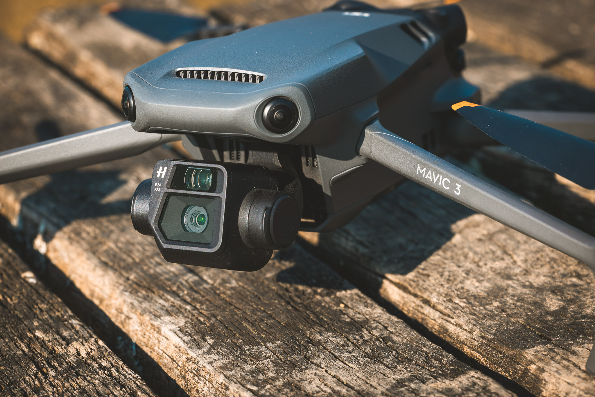 DJI Mavic 3 close-up highlighting the dual Hasselblad camera and front-facing obstacle avoidance sensors.