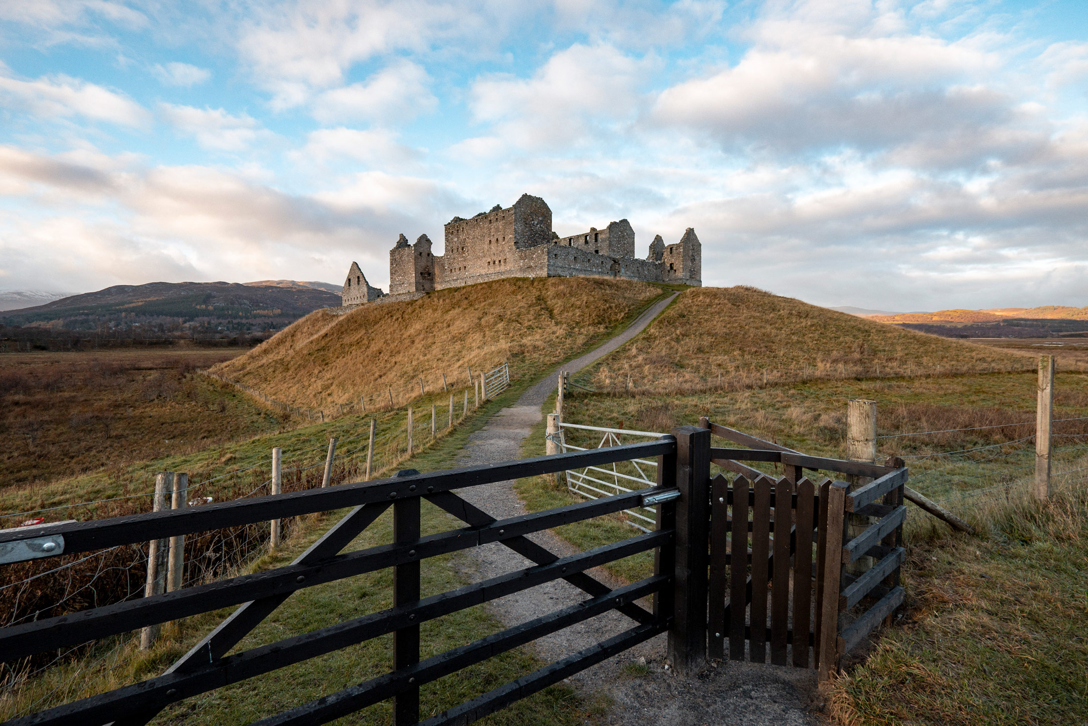 Wide distant view of a castle in the Scottish highlands, taken by Kristi Townsend on a used Canon PowerShot V1 from MPB.