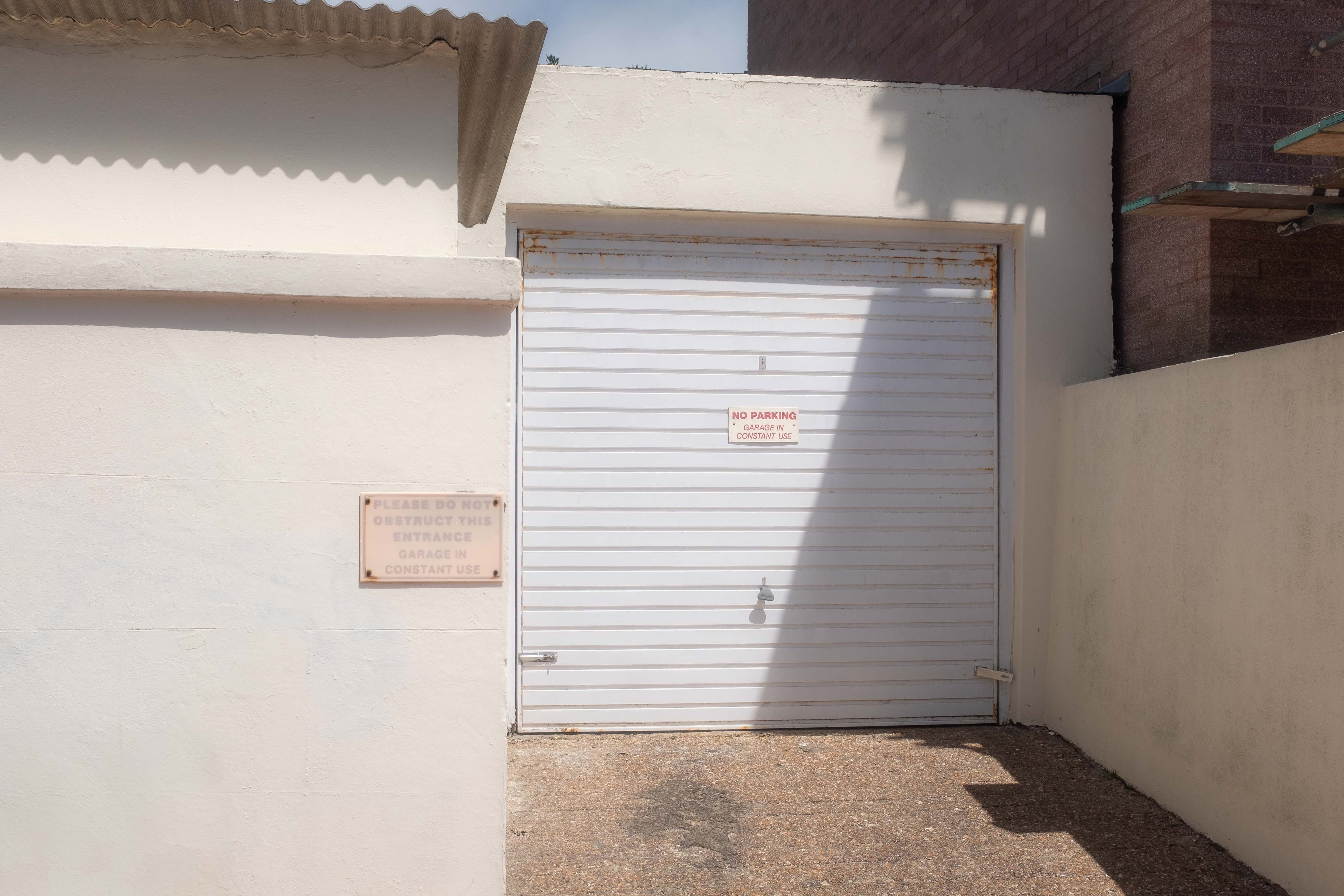 An interesting composition of walls and a garage door, all in pastel colours. Taken by Connor Redmond on the Fujifilm X100F.
