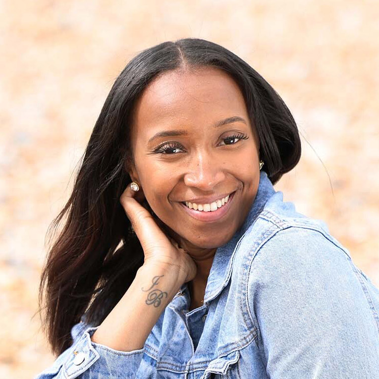A portrait photo of Jemella Binns wearing a denim shirt