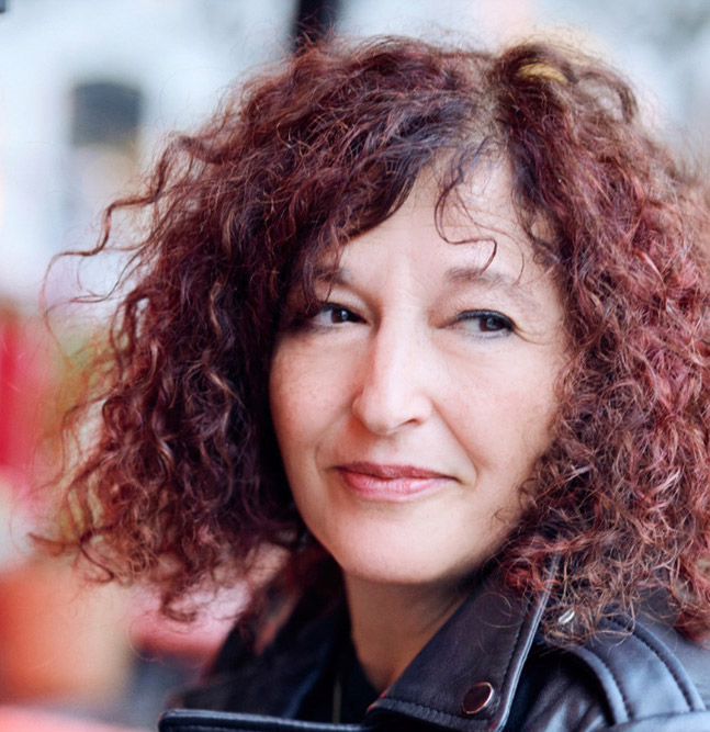 A portrait photo of Carolyn Mendelsohn wearing a black leather jacket