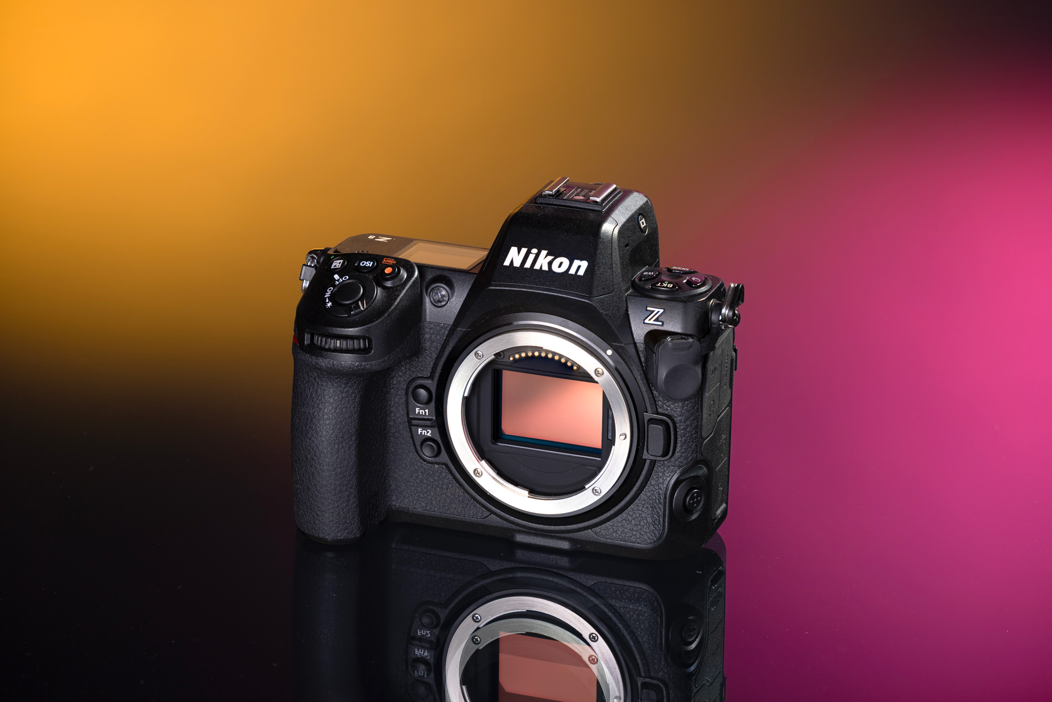Photo of a used Nikon Z8 camera from MPB shot in a studio on a yellow and pink background. 