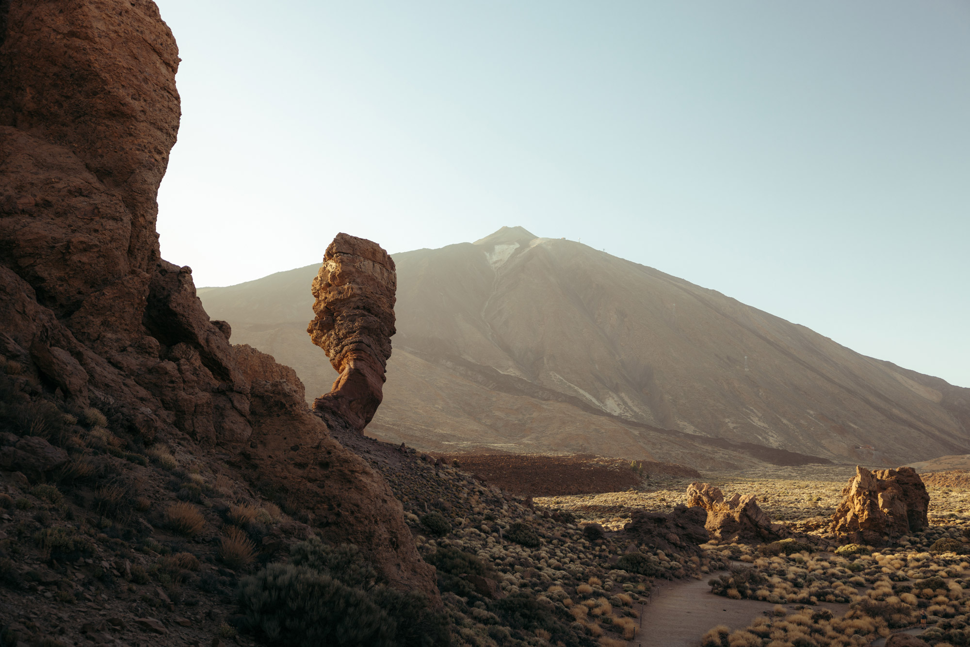 A mountain in the background with rock piles in the foreground, created with a Canon EOS R5 body and Canon RF 24-70mm f/2.8 lens by travel photographer Harry Pope