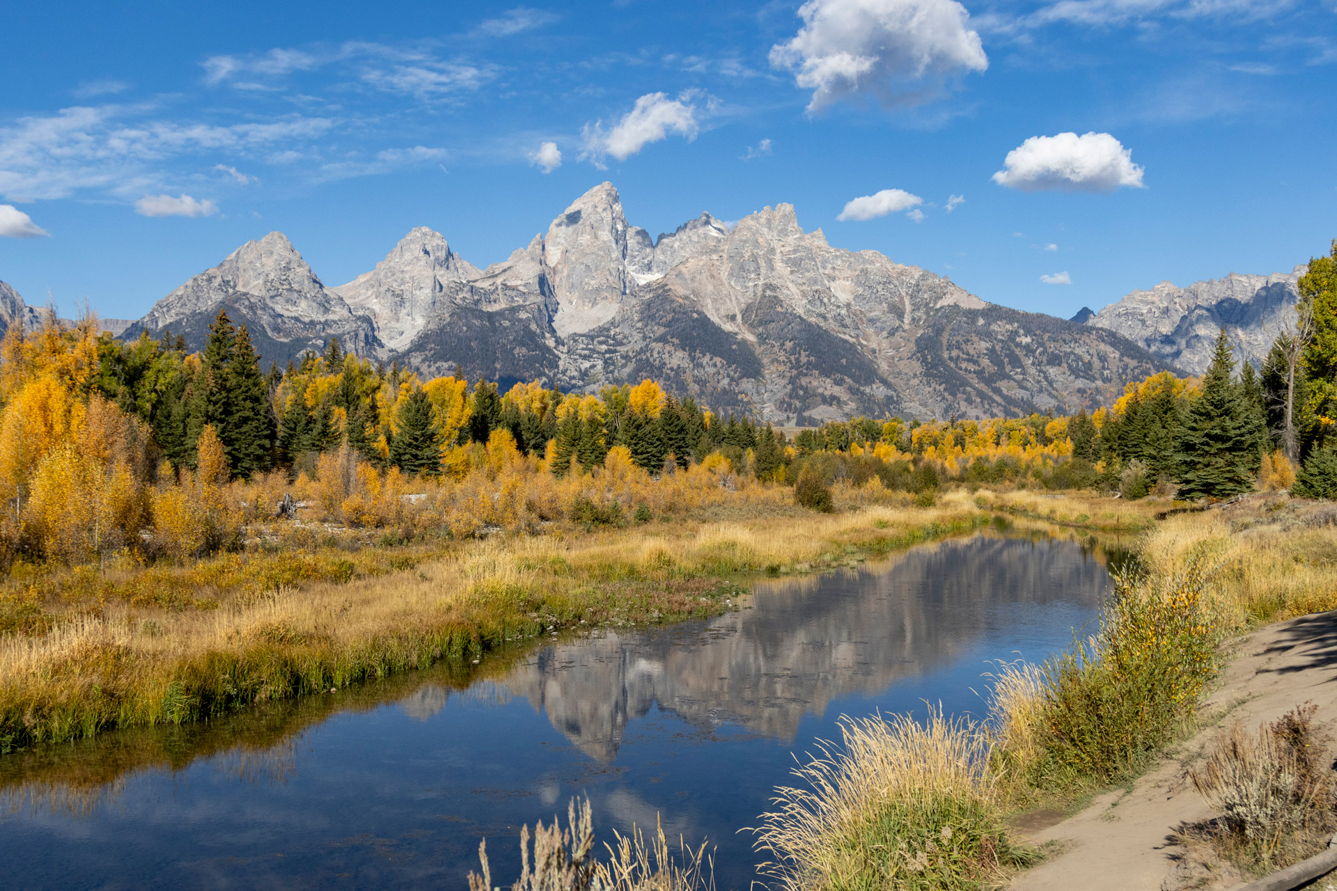 Image of Grand Teton Mountain range with river reflection from Schwabacher Landing in Wyoming. Image taken by Kristi Townsend on a Canon EOS R7.