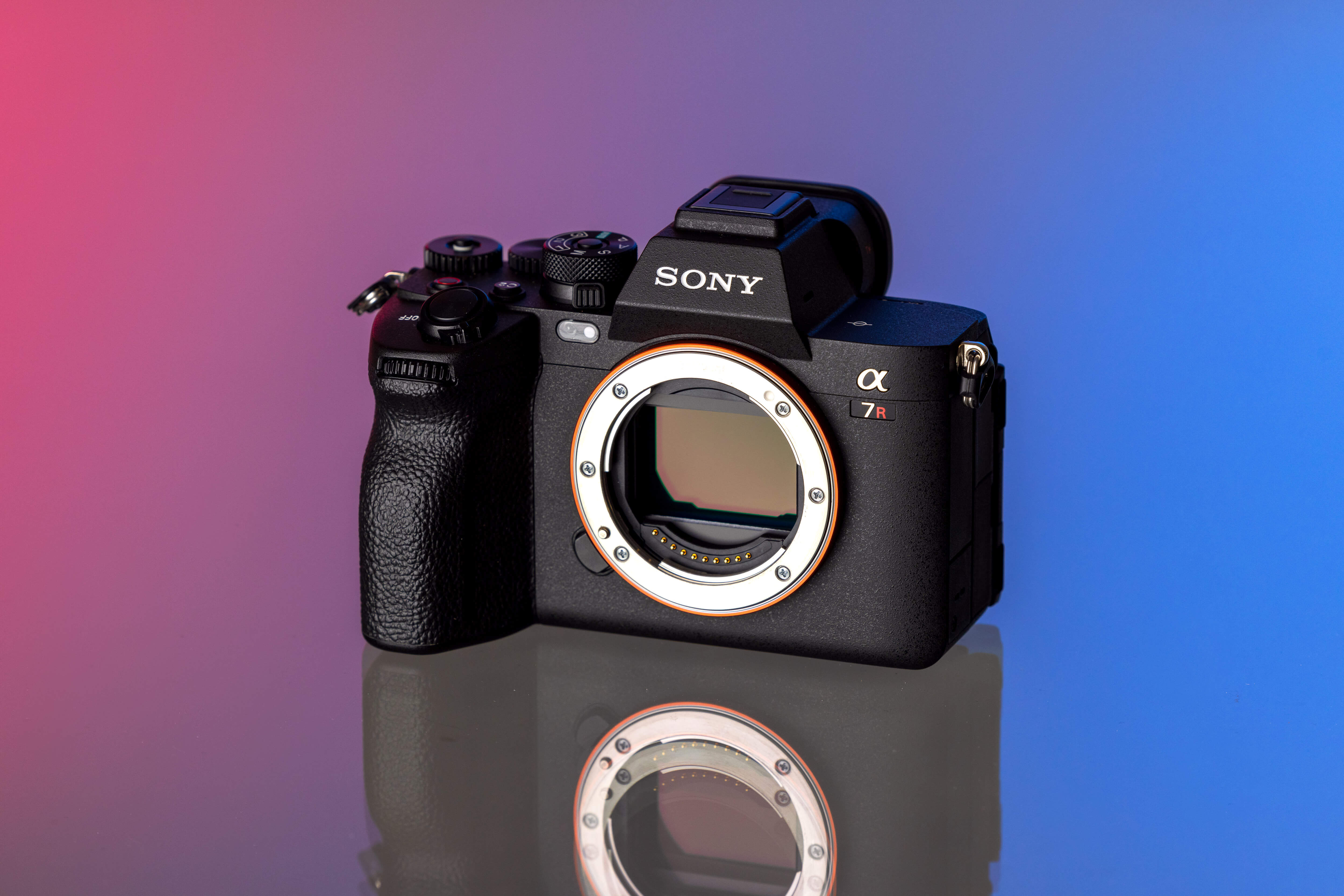 A Sony A7r V camera on a studio-lit white background.