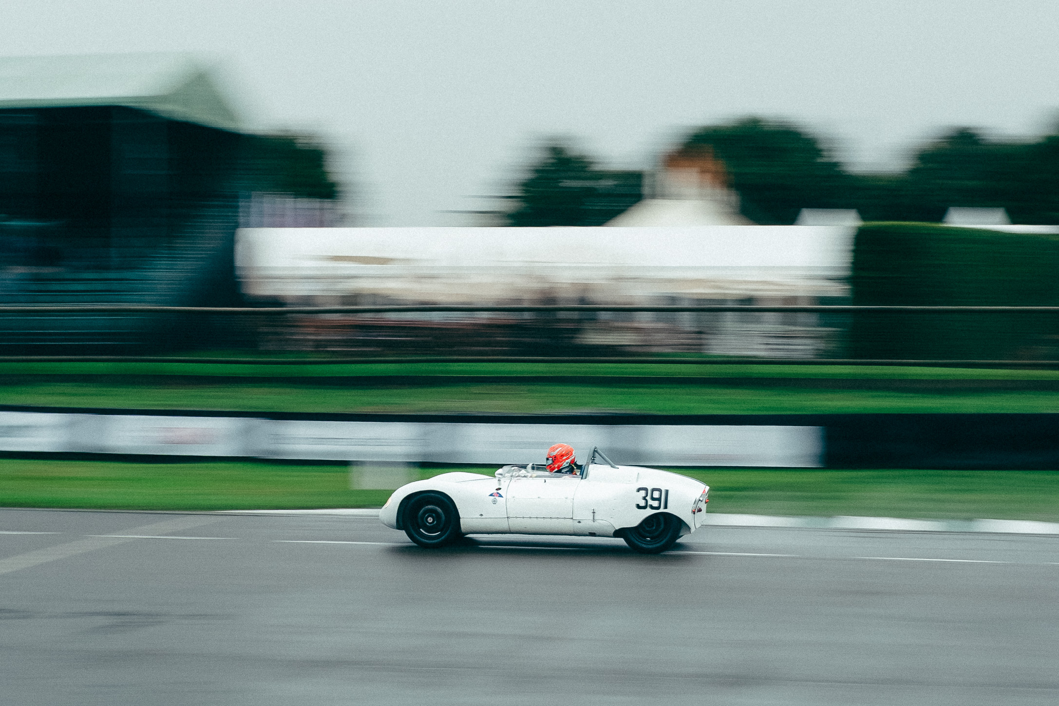 A fast action shot of a vintage car on a race track, looking like it is going fast. Taken by Connor Redmond on the Fujifilm X100F.
