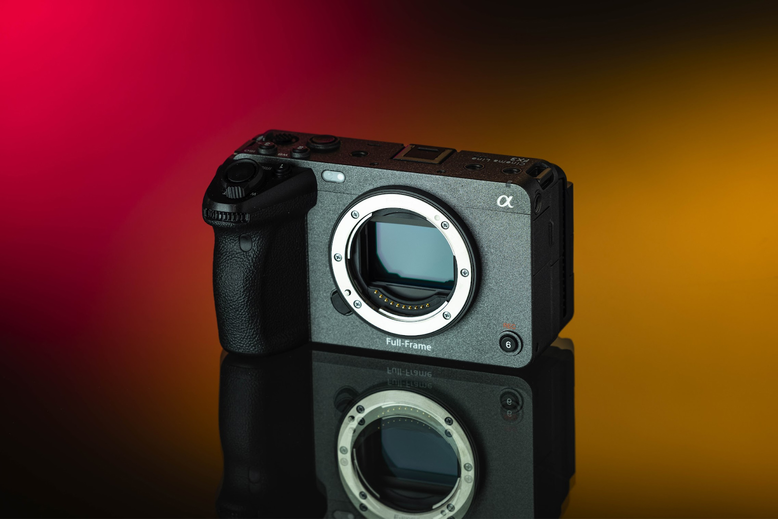Sony FX3 on a red, black and bronze background.