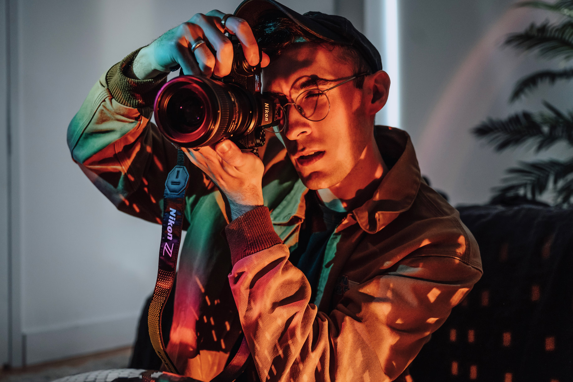 Photo of portrait photographer Brandon Woelfel with his Nikon camera