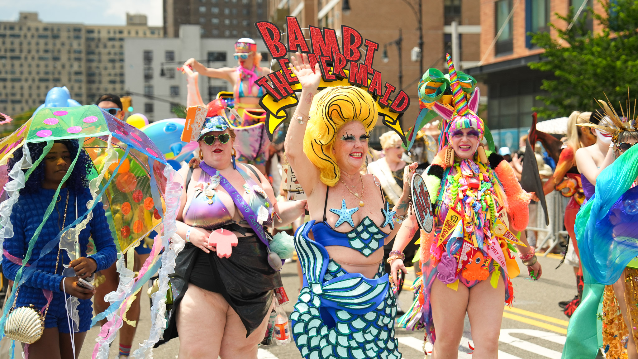 A group of dressed-up people at the Mermaid Parade. 
