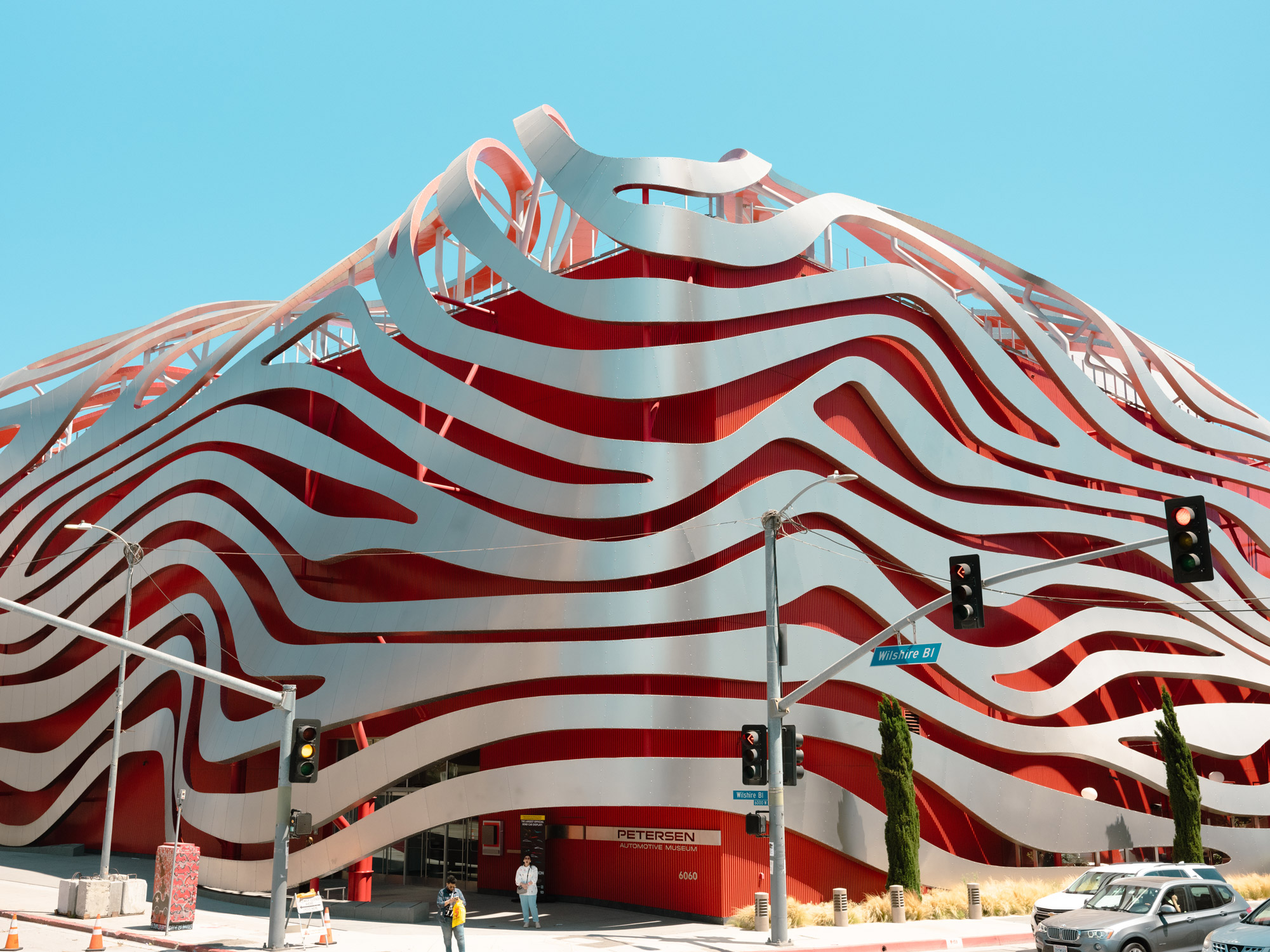 Red and silver architecture of the Petersen Automotive Museum in Los Angeles, California.