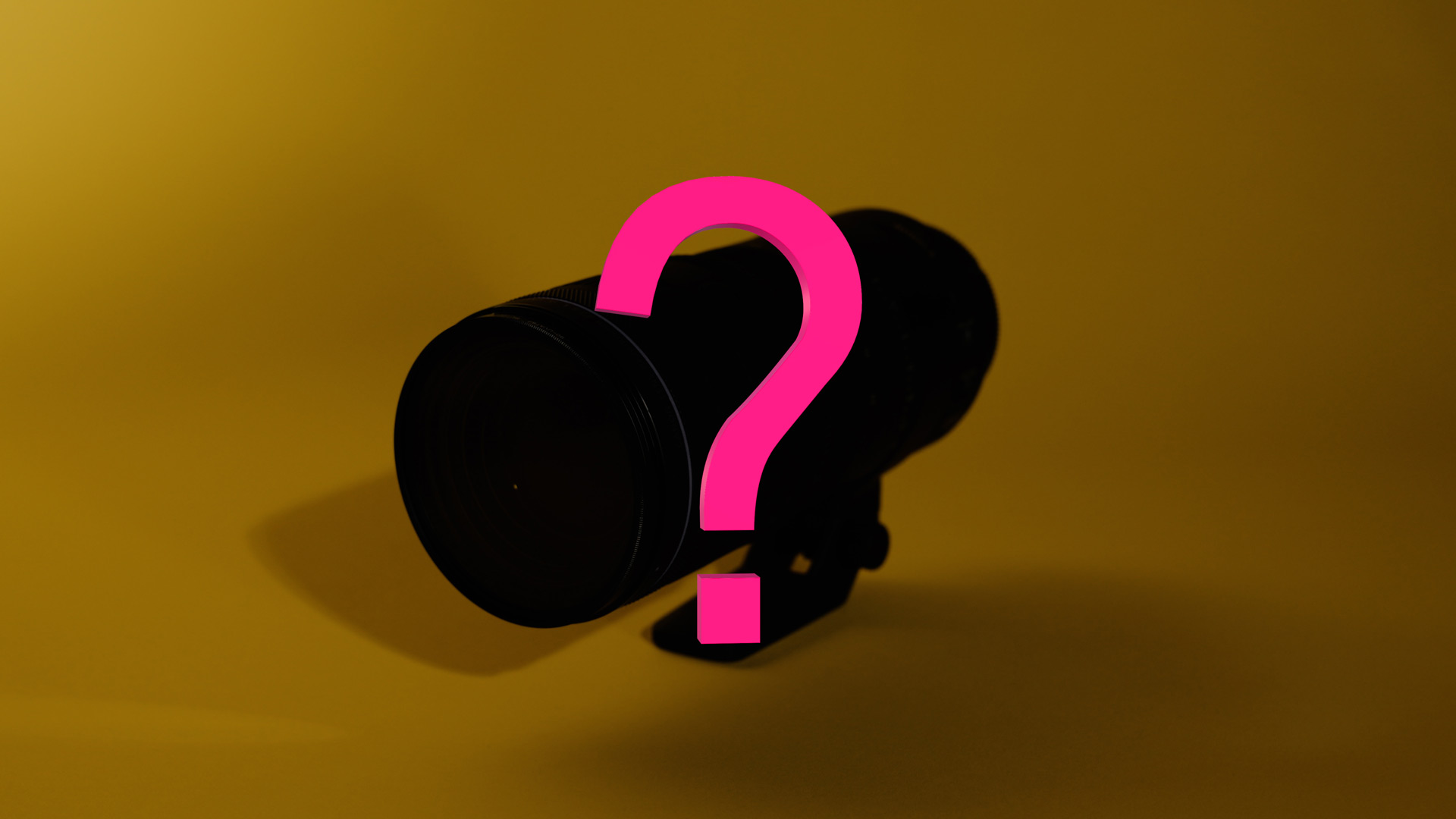 Silhouette of a zoom lens with a pink question mark over it, sitting against a gold background