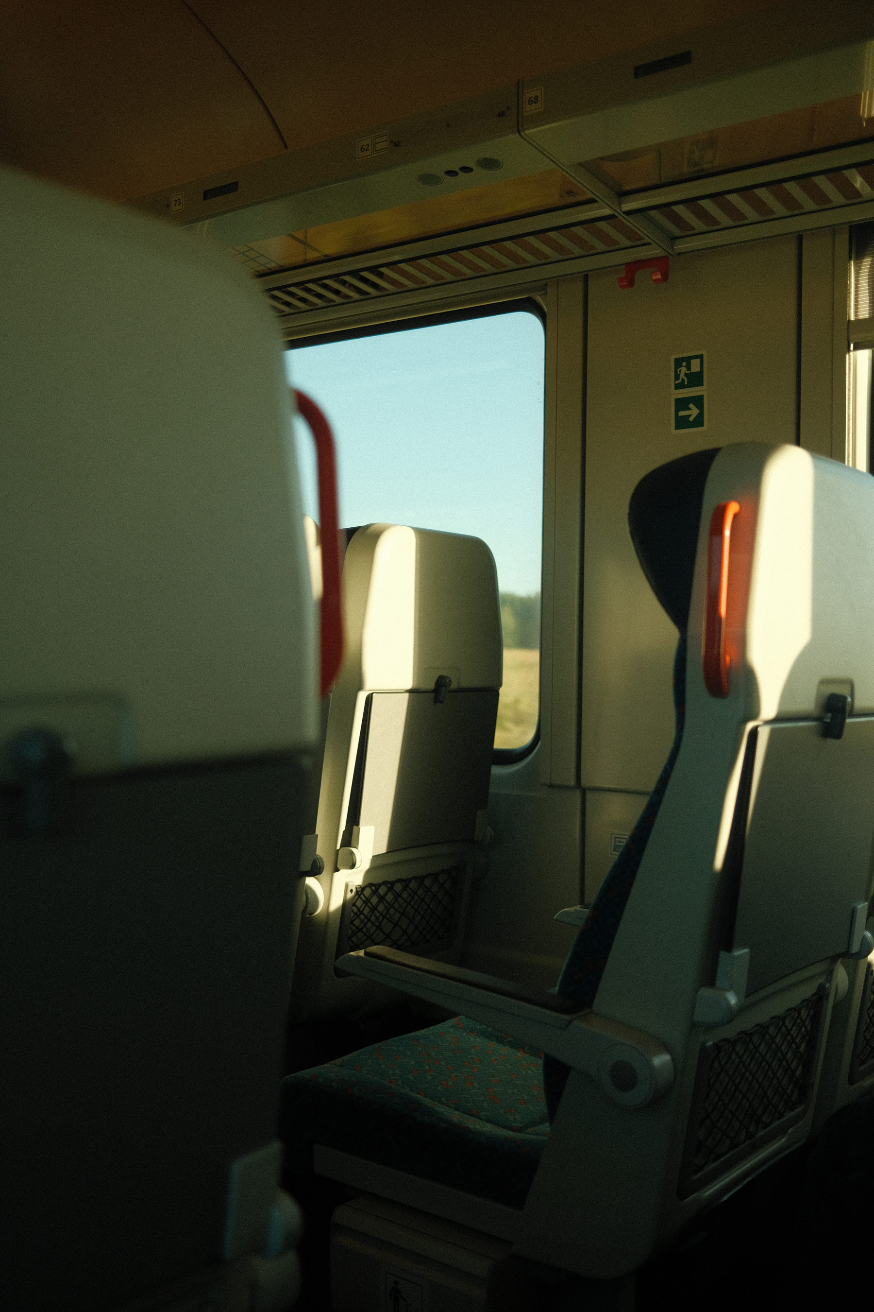 An empty seat in an empty train carriage, photo by Hermann Furin with a Fujifilm X100V