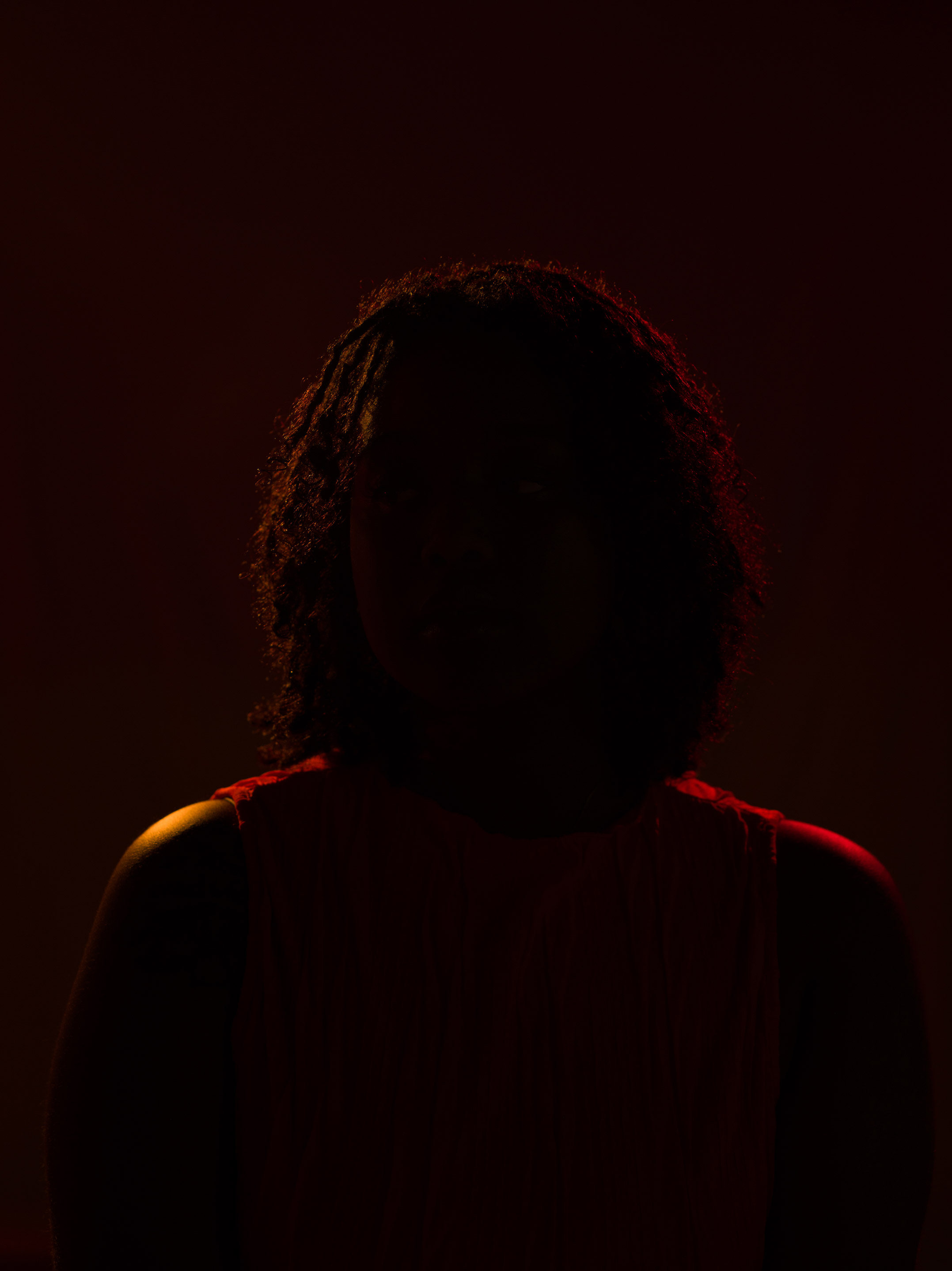 Portrait of a person using rim lighting technique by Kaylah Sambo on a Hasselblad X1D-50c.
