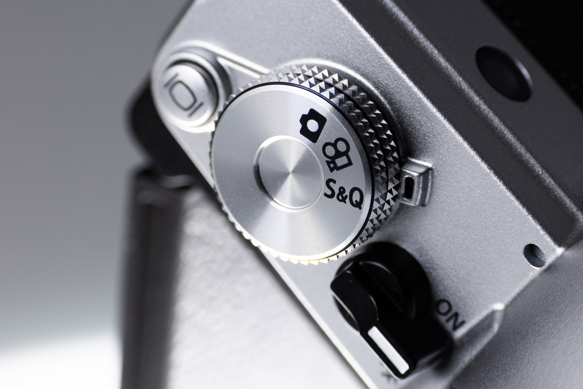 The dials on a used OM System OM-3 camera