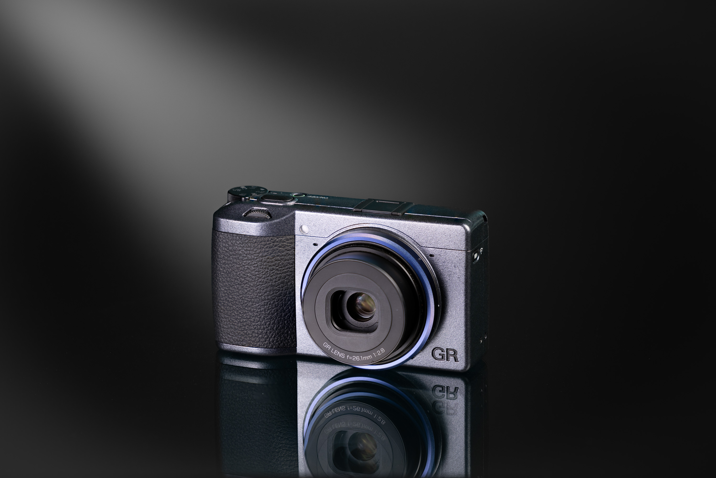 Used Ricoh GR IIIx on a black-and-white background